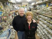Scott and Cathy Hughes, owners of Ridgefield True Value Hardware, stand in the aisle.