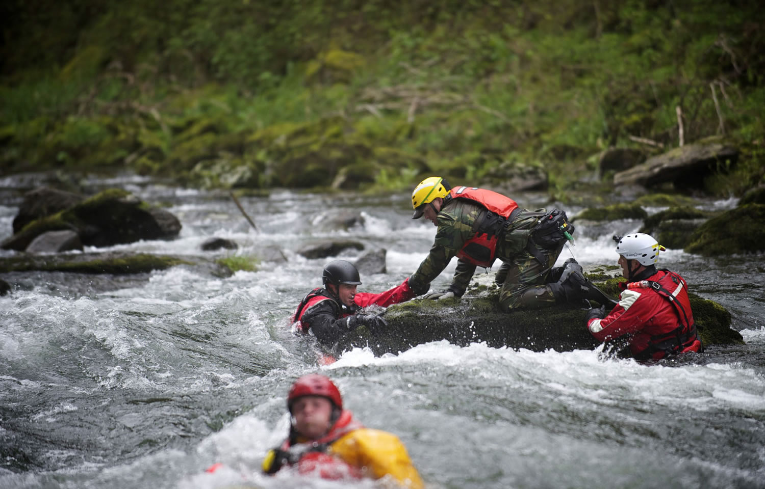 The Region 4 Technical Rescue team conducts water rescue drills at Big Eddy on the Washougal River on April 27.