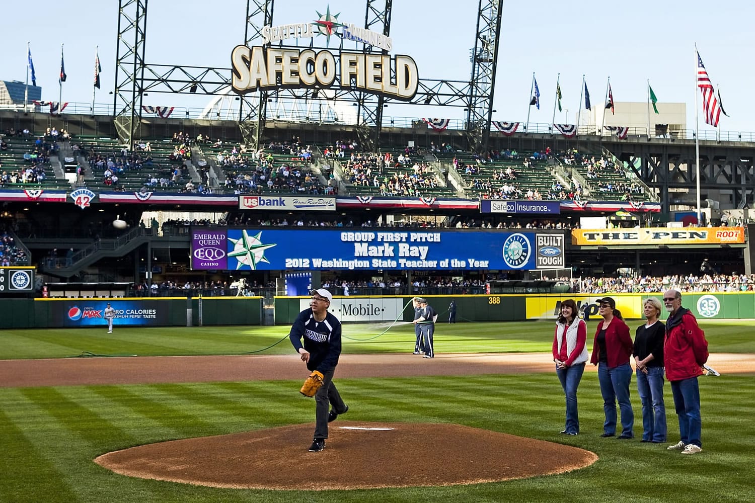 Mark Ray throws the ceremonial first pitch April 14.