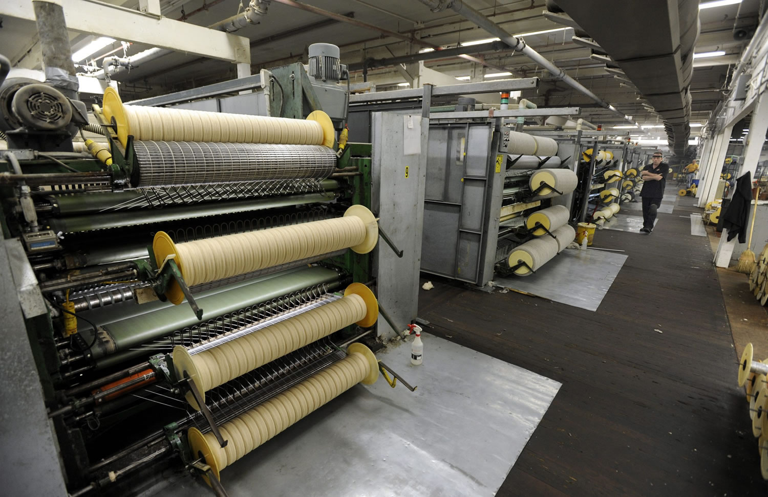 Wool yarn is carded at the Pendleton Woolen Mills.