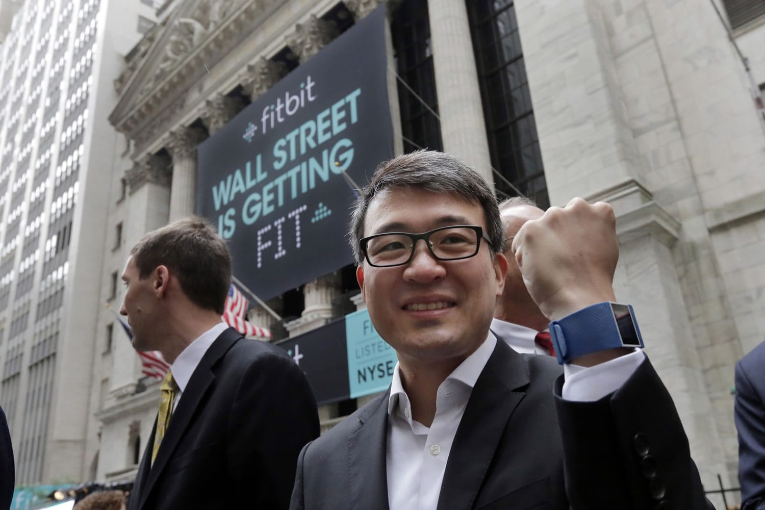 Fitbit CEO James Park shows off one of his devices on June 18 outside the New York Stock Exchange, before his company&#039;s IPO. The company&#039;s app was the most downloaded on Apple&#039;s app store on Christmas Day.
