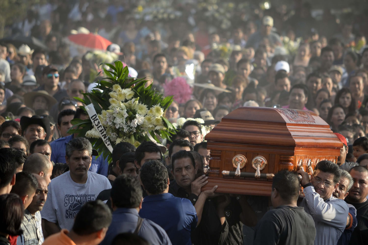 Mourners carry the coffin of slain mayor of Temixco, Gisela Mota, to the cemetery in Pueblo Viejo, Mexico, Sunday, Jan. 3, 2016. Mota took office as mayor of the city of on Jan. 1 and was shot at her home on Jan. 2. The governor of the southern Mexican state of Morelos says the killing of the mayor was a warning by drug gangs, meant to convince other officials to reject state police control of local forces.