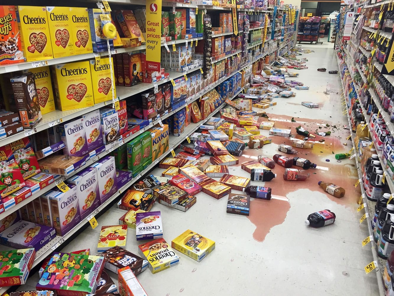 Boxes of cereal and bottles of juice lie on the floor of a Safeway grocery store Sunday following a magnitude-7.1 earthquake on the Kenai Peninsula, in south-central Alaska.