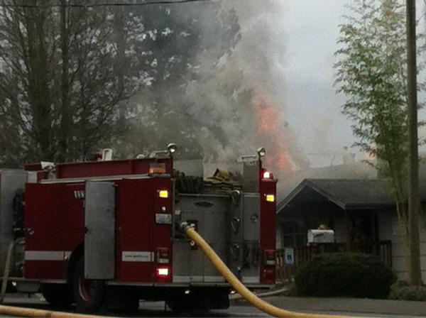 A house converted to office use was heavily damaged by fire Sunday.
