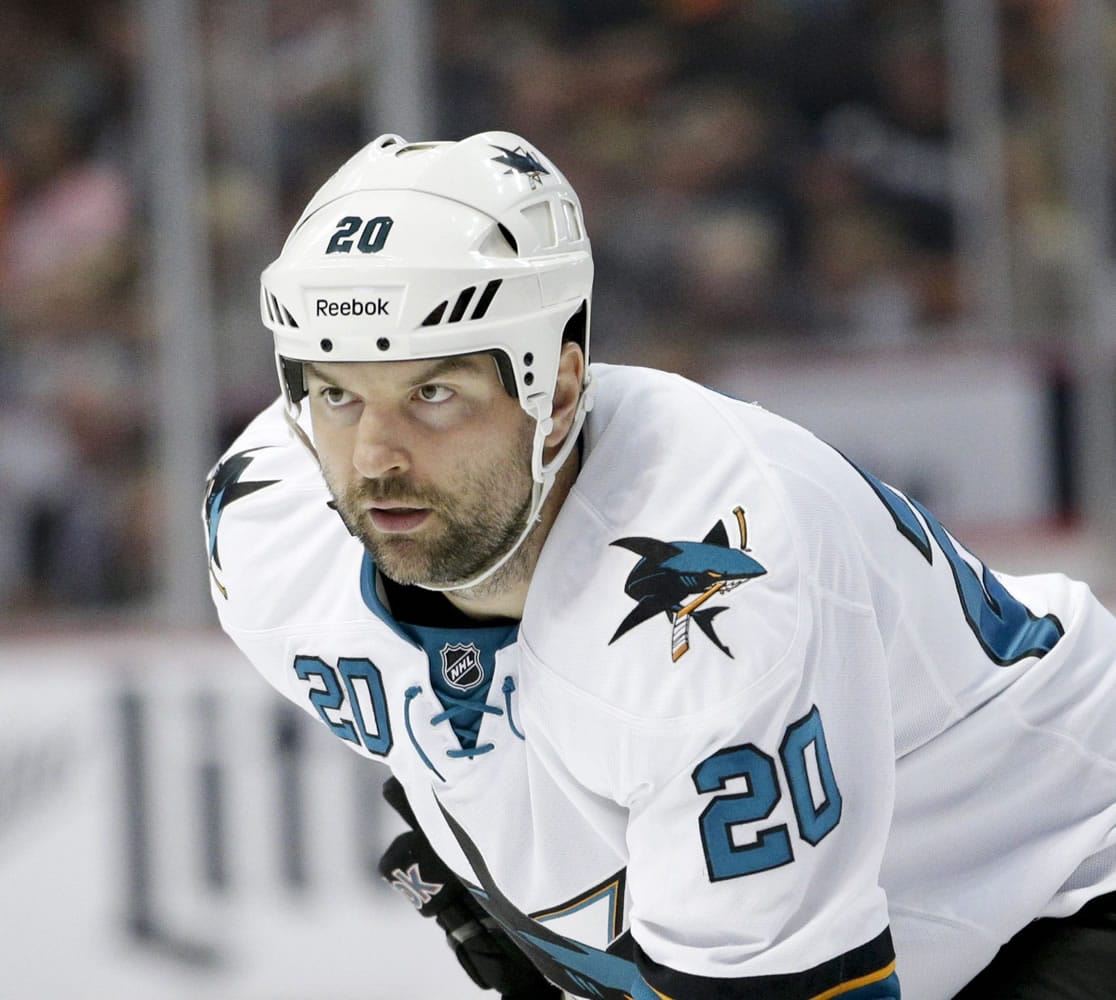 FILE - This is an Oct. 26, 2014, file photo showing San Jose Sharks' John Scott during the first period of an NHL hockey game against the Anaheim Ducks, in Anaheim, Calif. Despite a trade and a demotion to the minors, tough guy John Scott will still be allowed to play in the NHL All-Star 3-on-3 tournament. Scott was voted Pacific Division captain by fans. (AP Photo/Jae C.