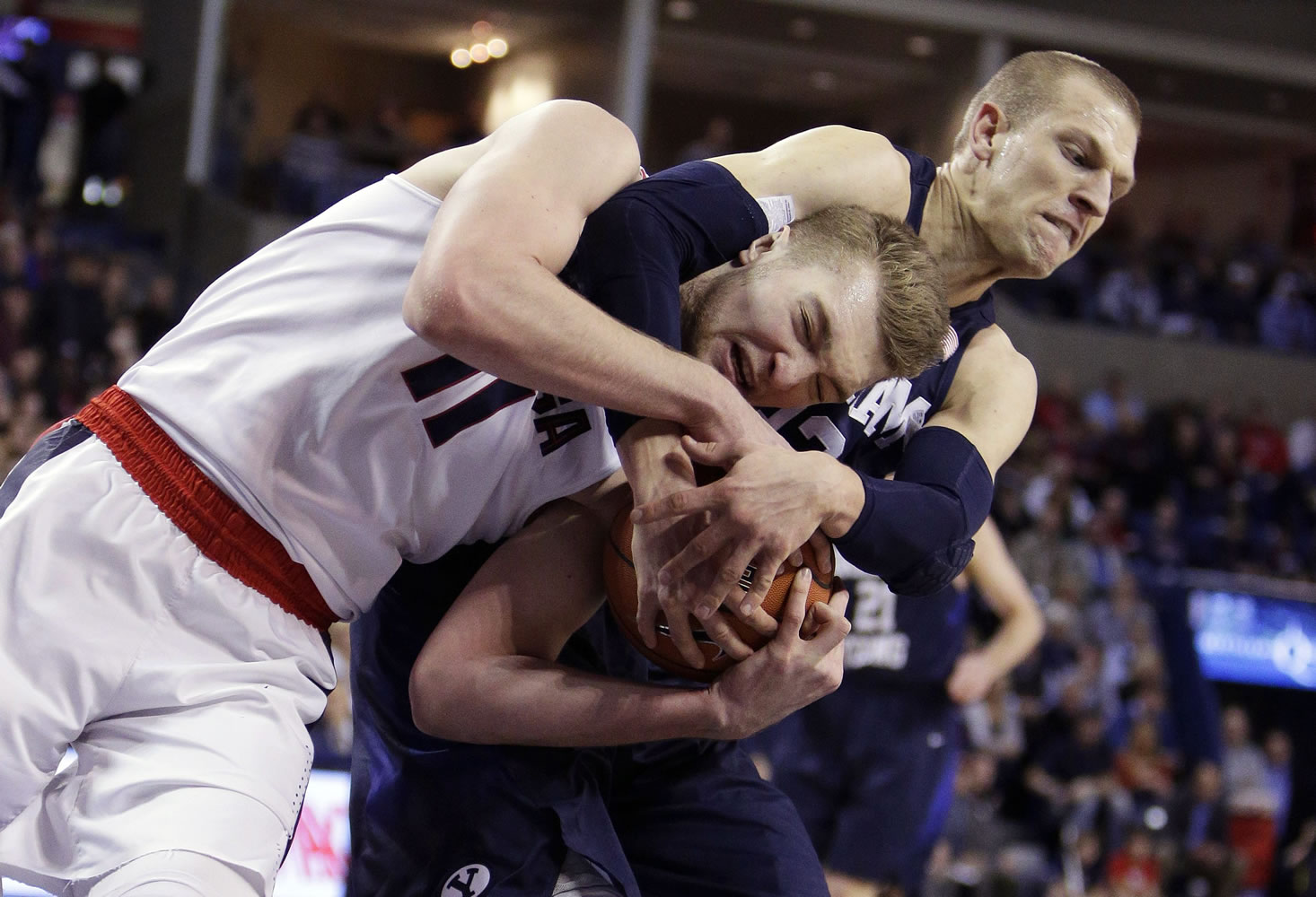 Gonzaga's Domantas Sabonis (11) and BYU's Nate Austin go after a rebound during the first half of an NCAA college basketball game, Thursday, Jan. 14, 2016, in Spokane, Wash.