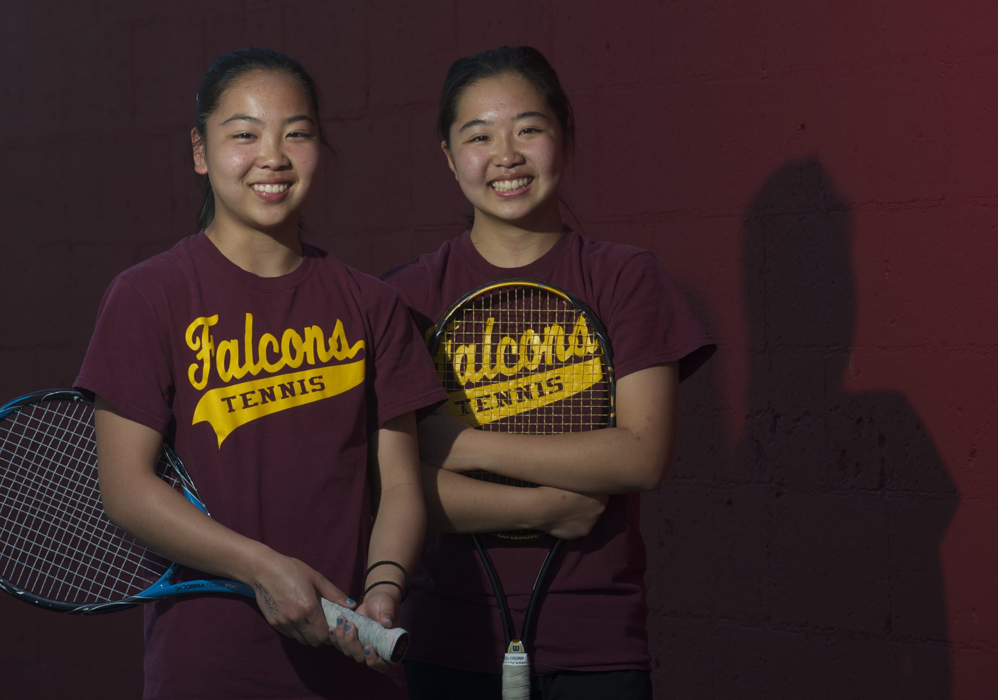 Prairie tennis team members and sisters (from left) Akari Baba, 14, and Shiori Baba, 17, pose for a portrait before a match at PHS on Monday April 23, 2012.