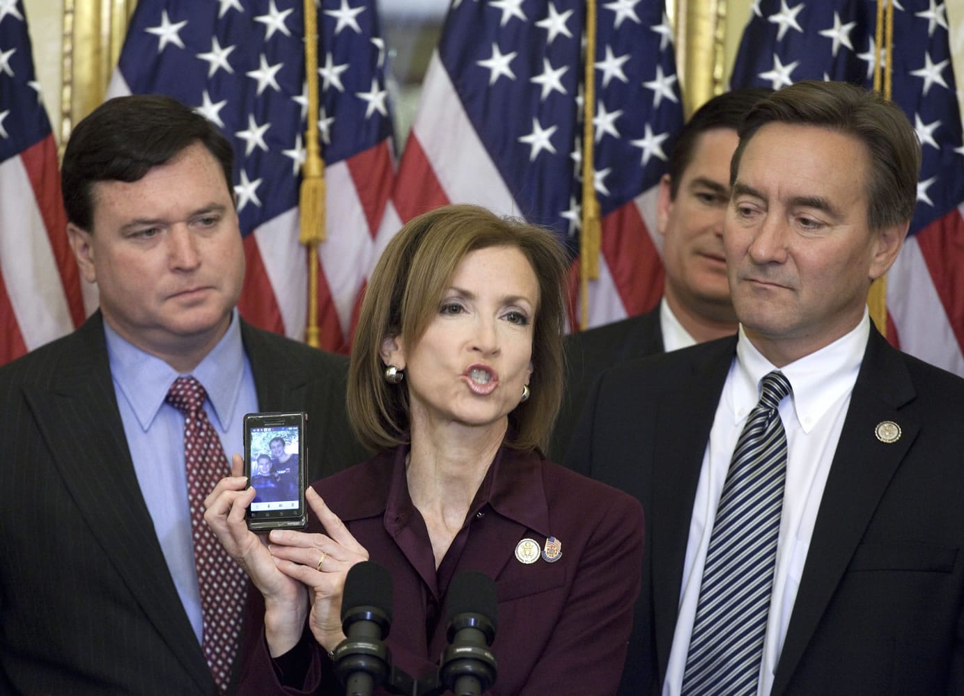 Rep. Nan Hayworth, R-N.Y., center, accompanied by, from left, Rep. Todd Rokita, R-Ind., Rep. Austin Scott, R-G., and Rep. Rick Berg, R-N.D., shows a photo of her children, Will and Jack, during a House Republican freshmen news conference on Capitol Hill in Washington, Thursday, Nov. 17, 2011, to discuss a Balanced Budget Amendment.