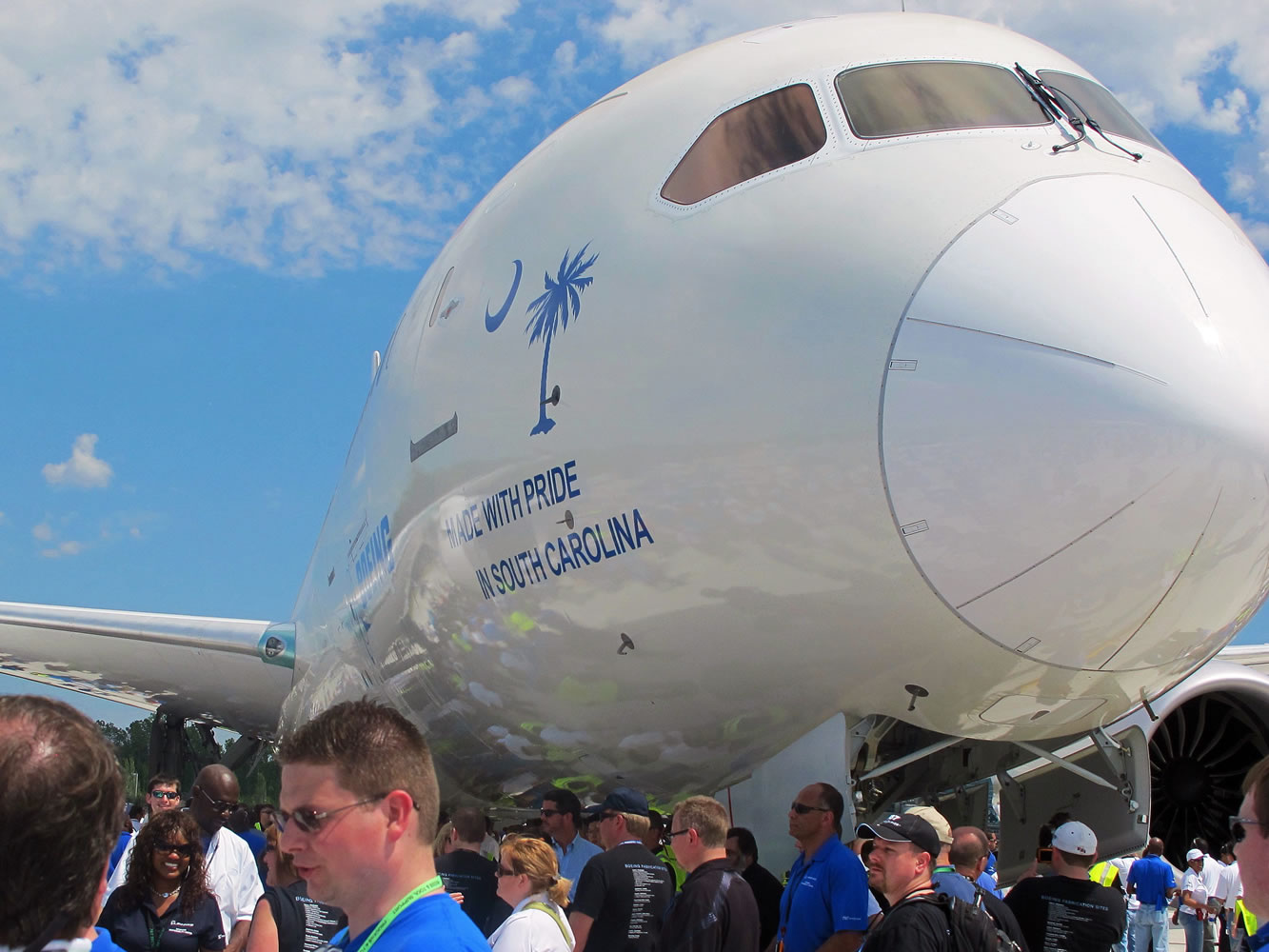 Boeing workers gather around the new 787 at the company's assembly plant Friday in North Charleston, S.C.
