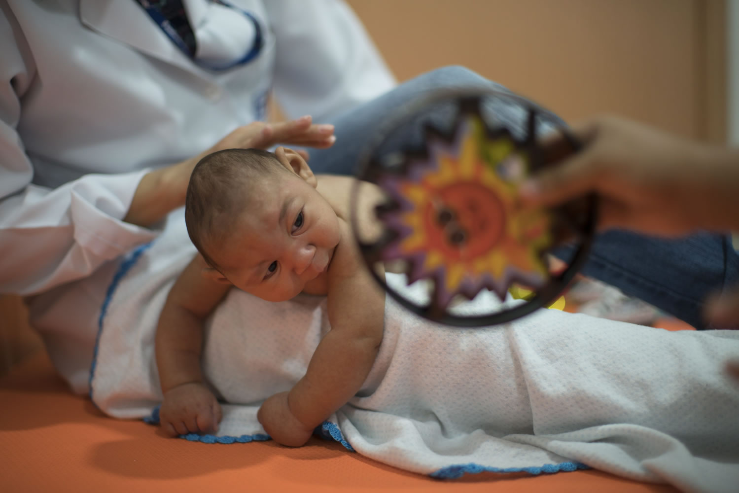 Three-month-old Daniel, who was born with microcephaly, undergoes physical therapy Thursday at the Altino Ventura Foundation in Recife, Brazil.