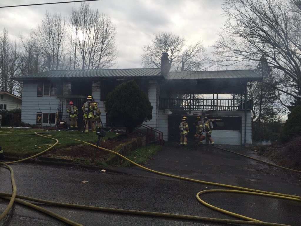 Firefighters respond to a house fire this morning on Northeast 83rd Street in Hazel Dell. The fire reportedly started in an attached garage but spread to the home.