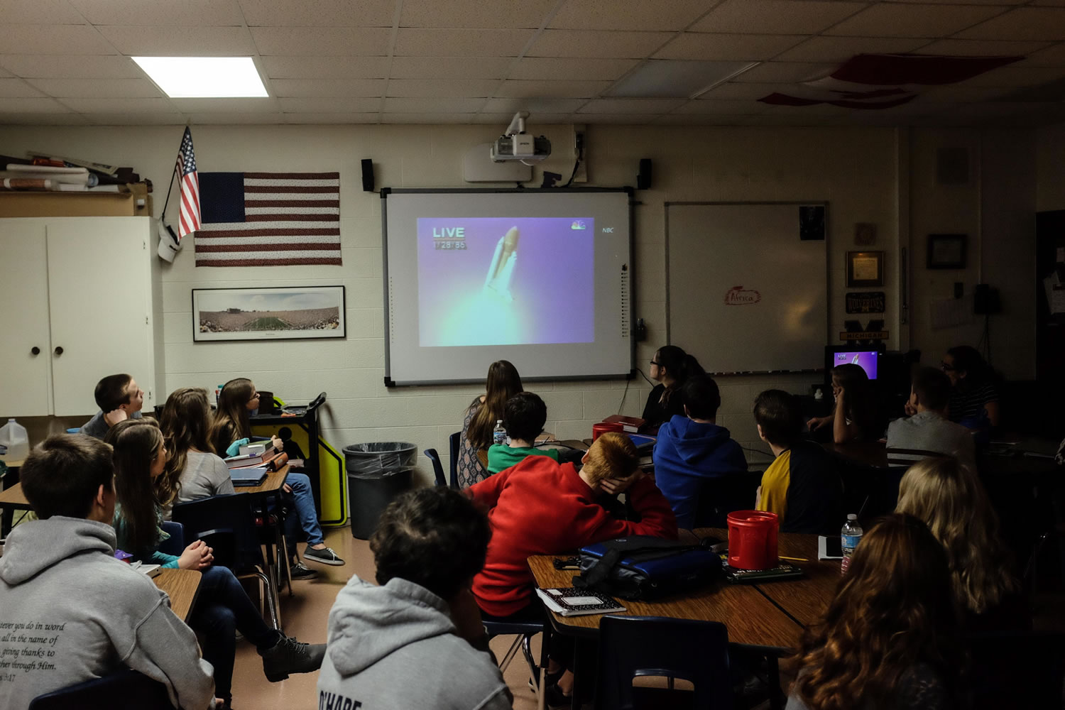 Eighth-grade students in Bangor Township, Mich., watch a video Thursday of the January 1986 Challenger space shuttle launch. The students were learning about teacher-astronaut Christa McAuliffe, whom their middle school is named after, on the space shuttle accident's 30th anniversary.