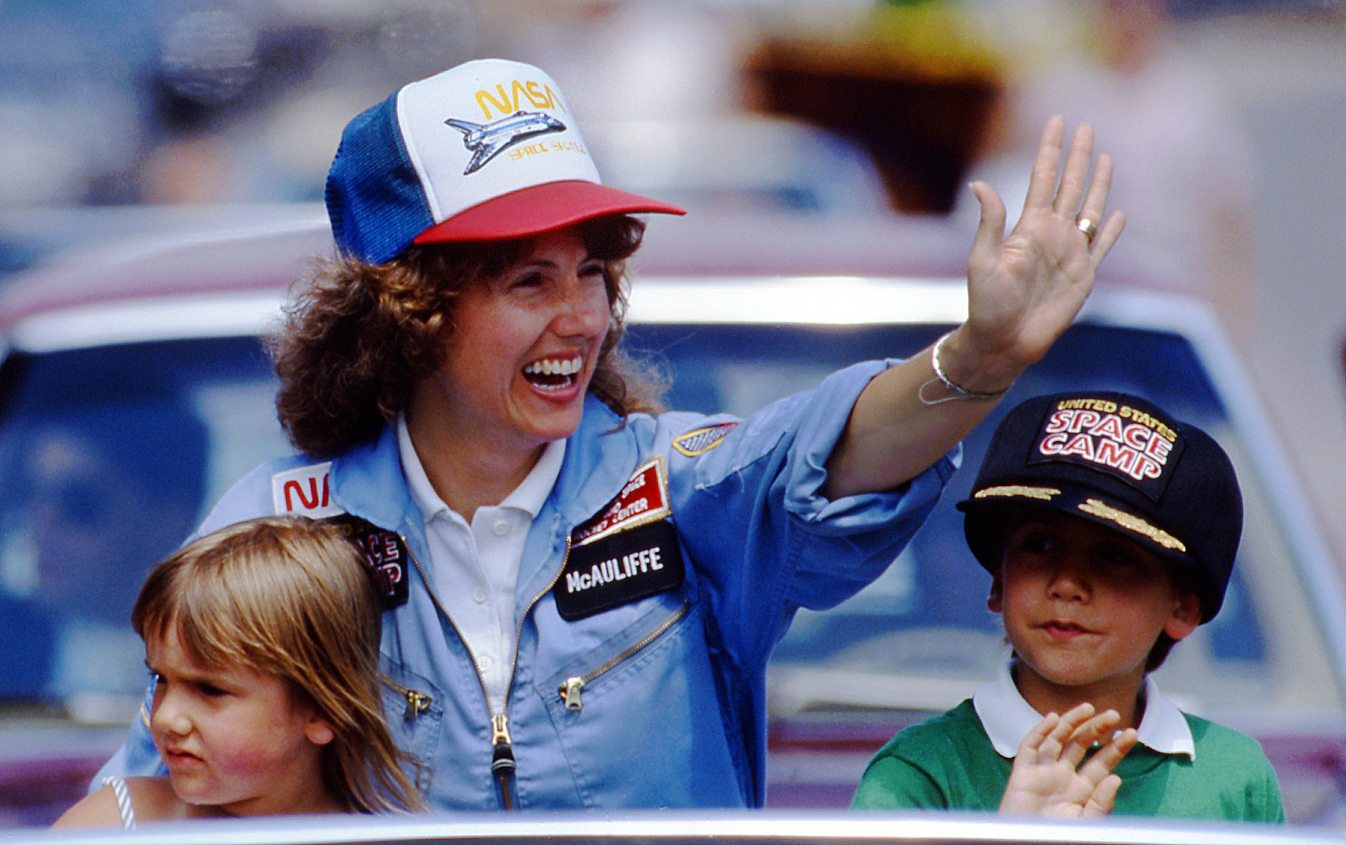 In this 1985 photo, high school teacher Christa McAuliffe rides with her children Caroline, left, and Scott during a parade down Main Street in Concord, N.H. McAuliffe was one of seven crew members killed in the Space Shuttle Challenger explosion on Jan. 28, 1986.