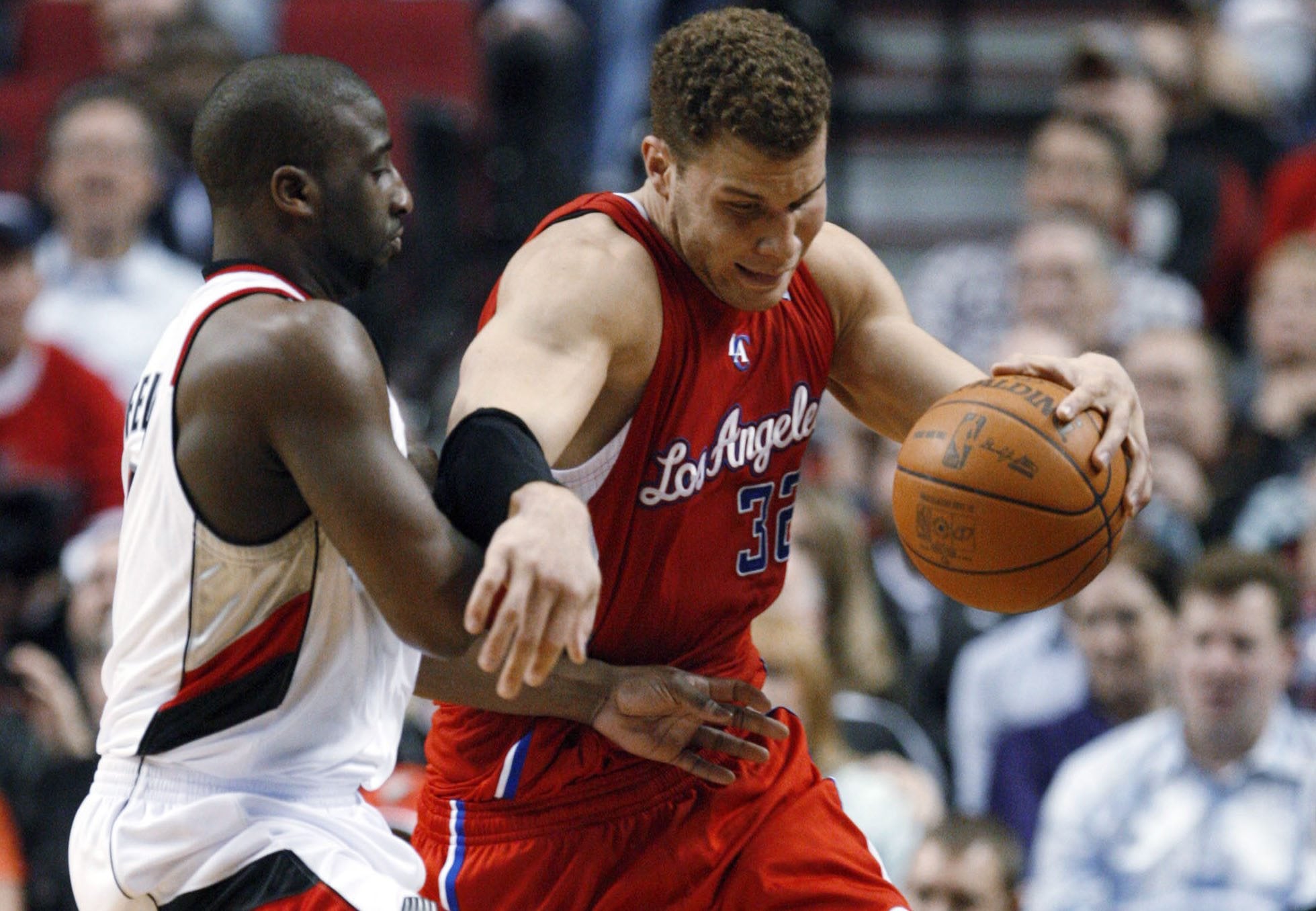 Los Angeles Clippers' Blake Griffin (32) drives past Portland Trail Blazers' Raymond Felton (5) in the second quarter of an NBA basketball game Thursday, Feb. 16, 2012, in Portland, Ore.