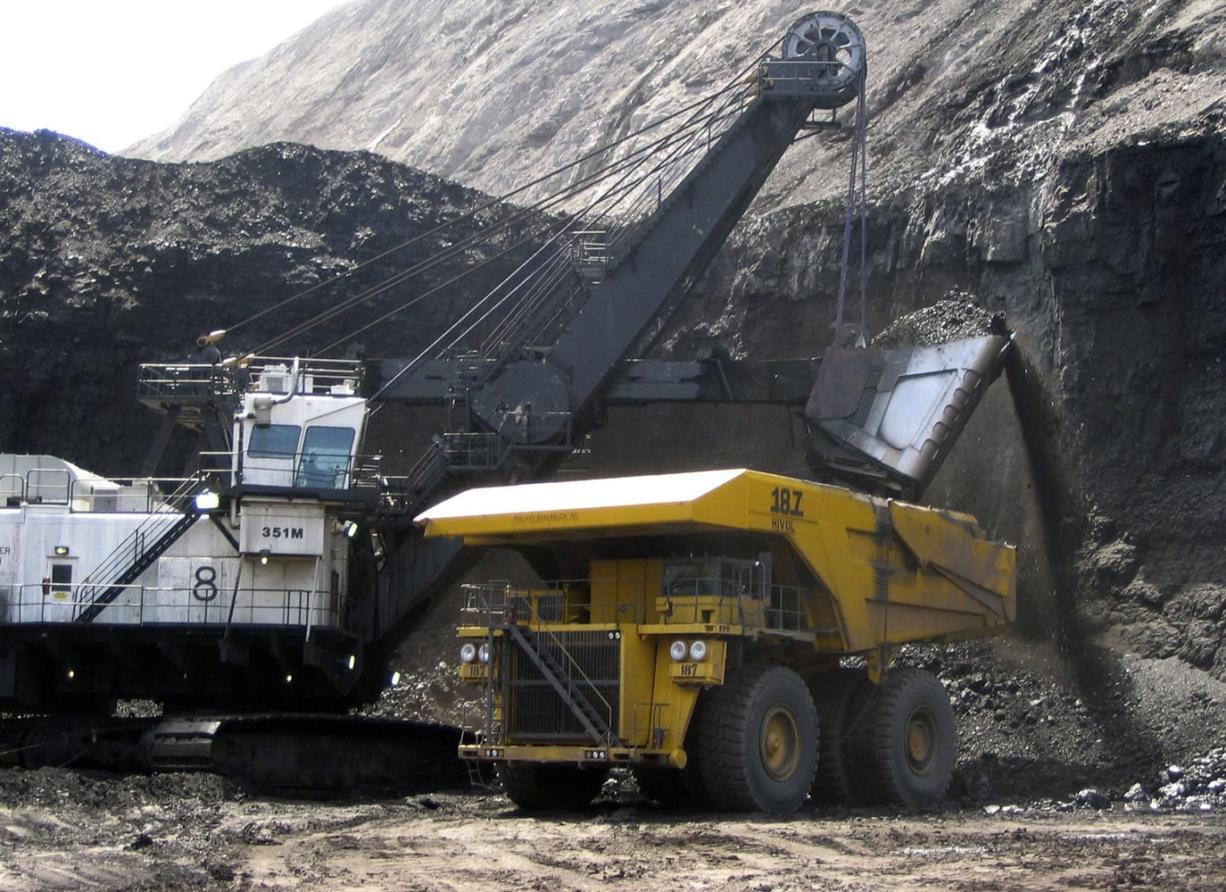 A shovel prepares to dump a load of coal into a 320-ton truck at the Black Thunder Mine in Wright, Wyo., in 2007.
