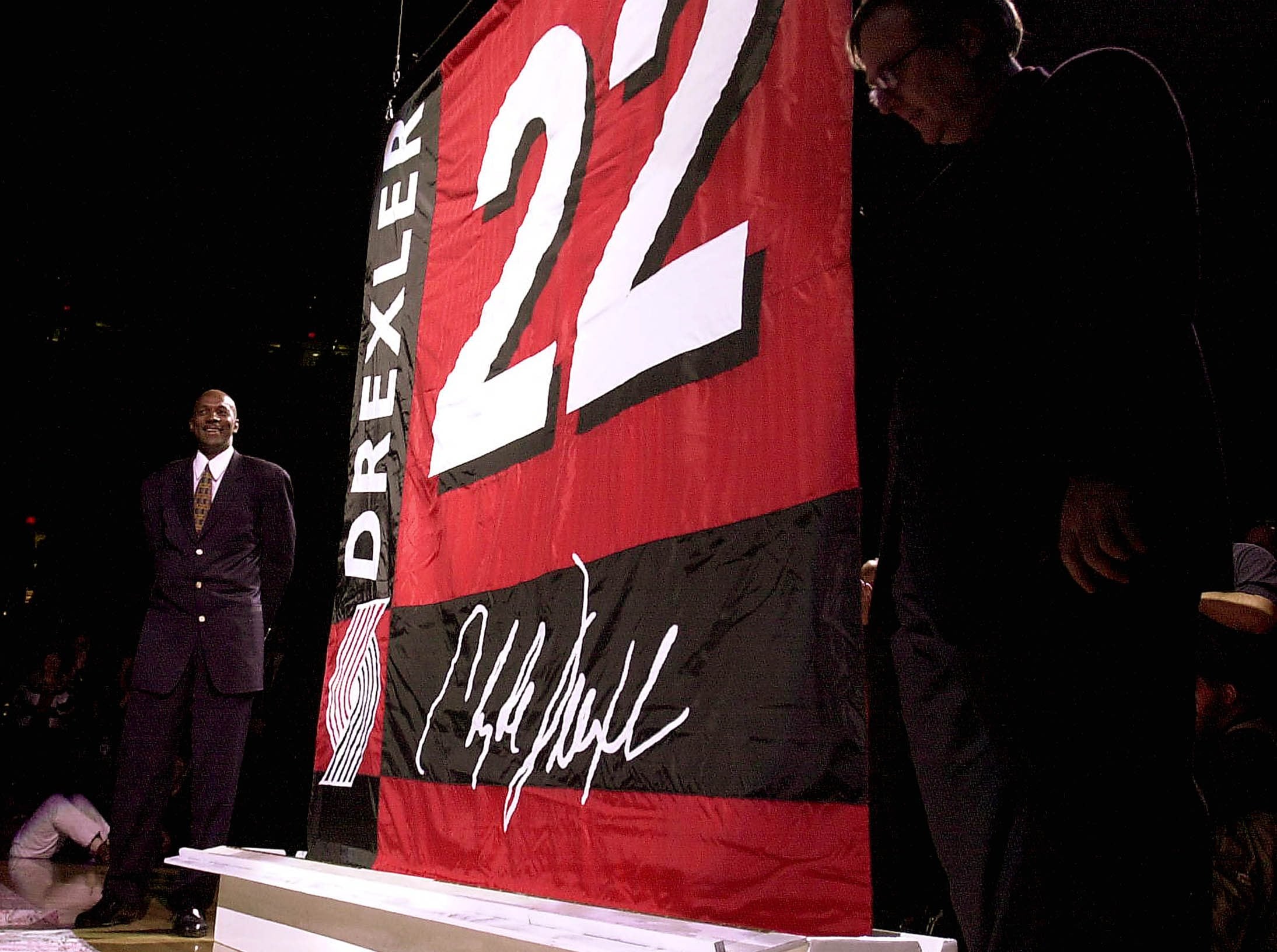 Former Trail Blazer Clyde Drexler, left, had his number raised into the rafters of the Rose Garden in 2001.