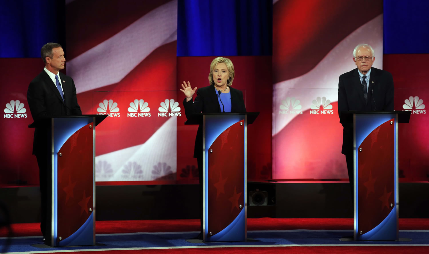 Democratic presidential candidate Hillary Clinton, center, speaks at the Democratic presidential debate at the Gaillard Center on Sunday in Charleston, S.C. To the left is Democratic presidential candidate and former Maryland Gov. Martin O'Malley and Democratic presidential candidate Sen. Bernie Sanders, I-Vt, left.