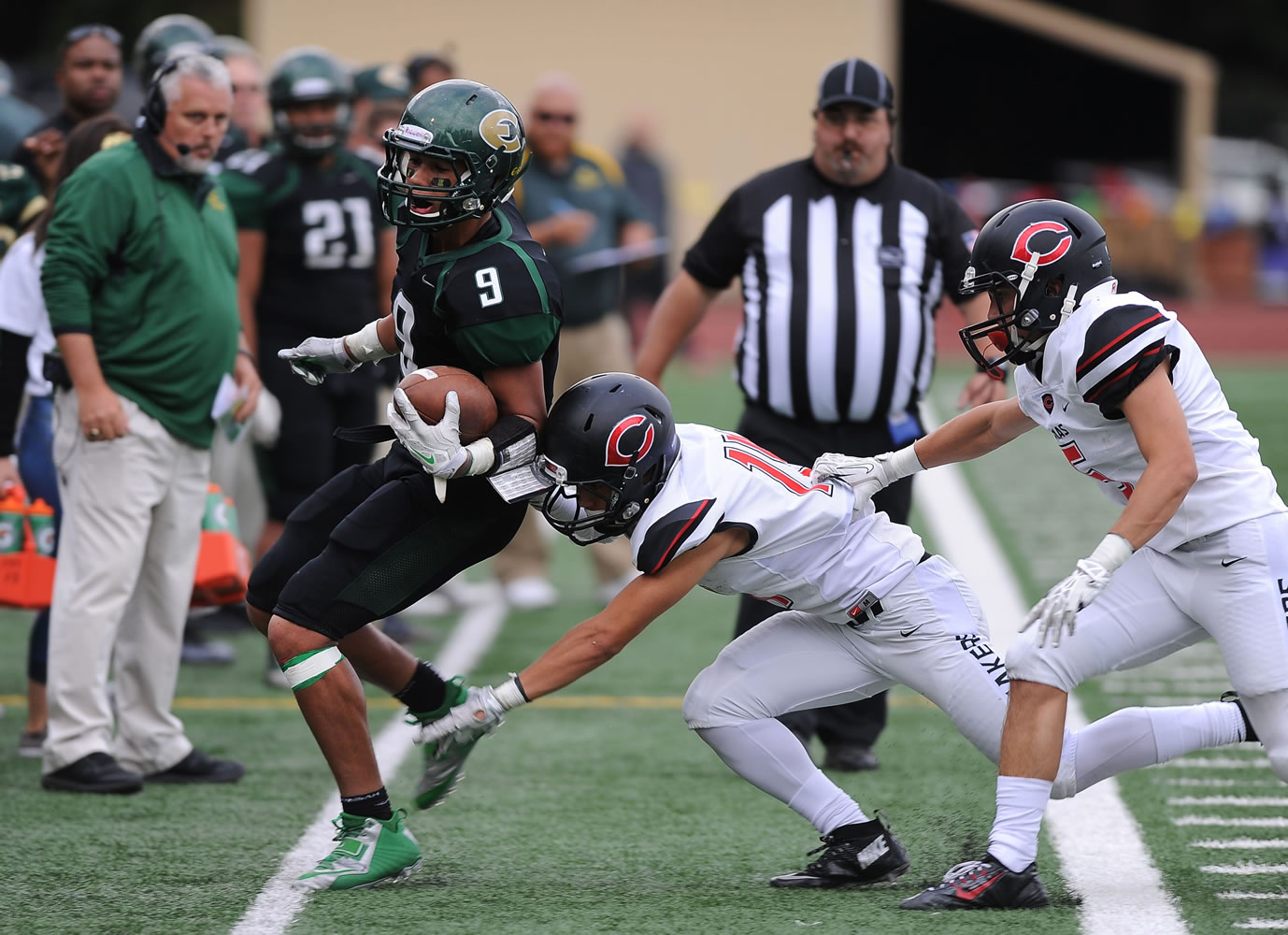 Evergreen player Dustin Nettles is tackled by Camas player Kade Anderson during a game at McKenzie Stadium in Vancouver Friday September 25, 2015.