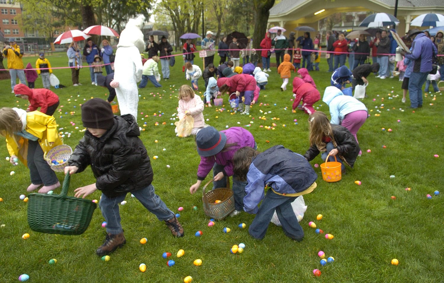 Children pick up plastic eggs at the annual Easter egg hunt at Esther Short Park.