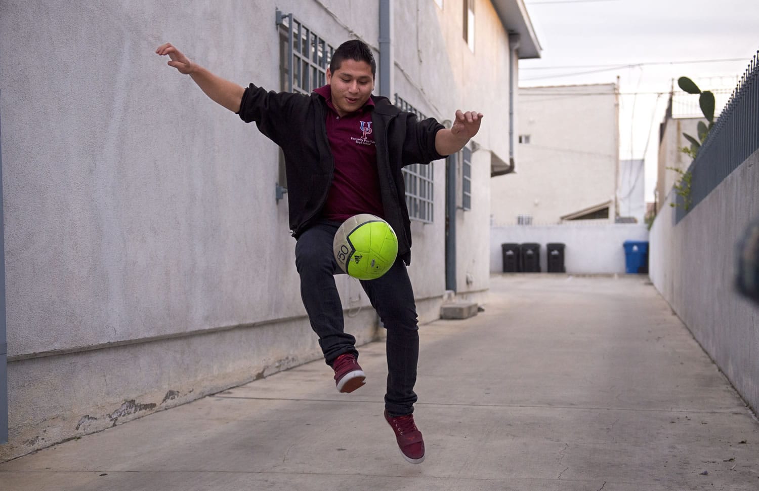 Marvin Velasco, 15, practices soccer outside his new home in Los Angeles on Monday. Velasco&#039;s perilous journey from Guatemala included crossing a river, even though he doesn&#039;t swim, and getting lost at night in a frigid desert. Once in the United States, he turned himself in to U.S. Border Patrol agents in Reynosa, Texas, and was sent to a shelter run by the U.S. Department of Health and Human Services&#039; Office of Refugee Resettlement. (AP Photo/Mark J.