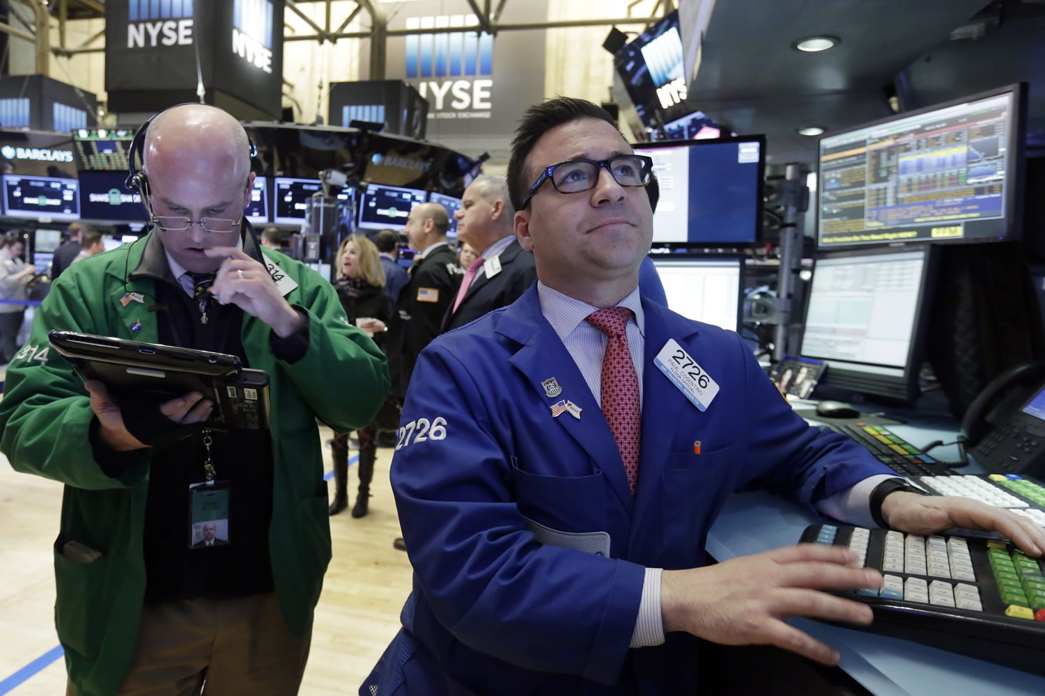 Trader Kevin Walsh, left, and specialist Paul Cosentino work on the floor of the New York Stock Exchange on Thursday.