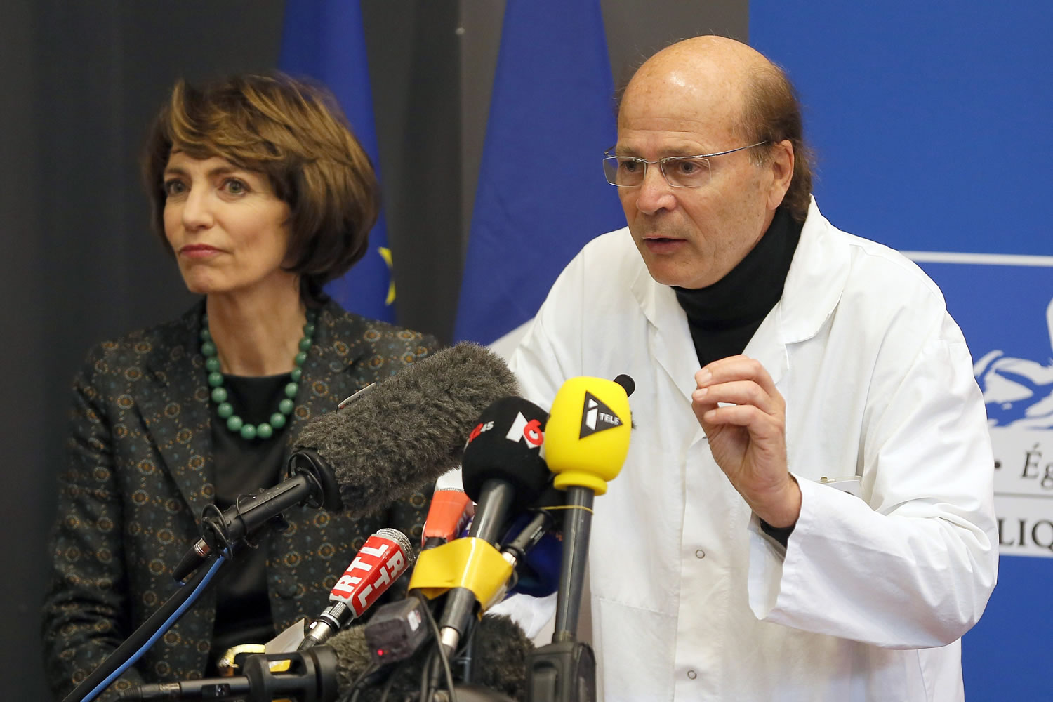 French Health Minister Marisol Touraine, left, and Professor Gilles Edan, the chief neuroscientist at Rennes Hospital, address the media during a Friday press conference in Rennes, western France. Six previously healthy medical volunteers have been hospitalized -- including one man who is now brain dead -- after taking part in a botched drug test at the Biotrial lab in western France, the French Health Ministry said Friday.