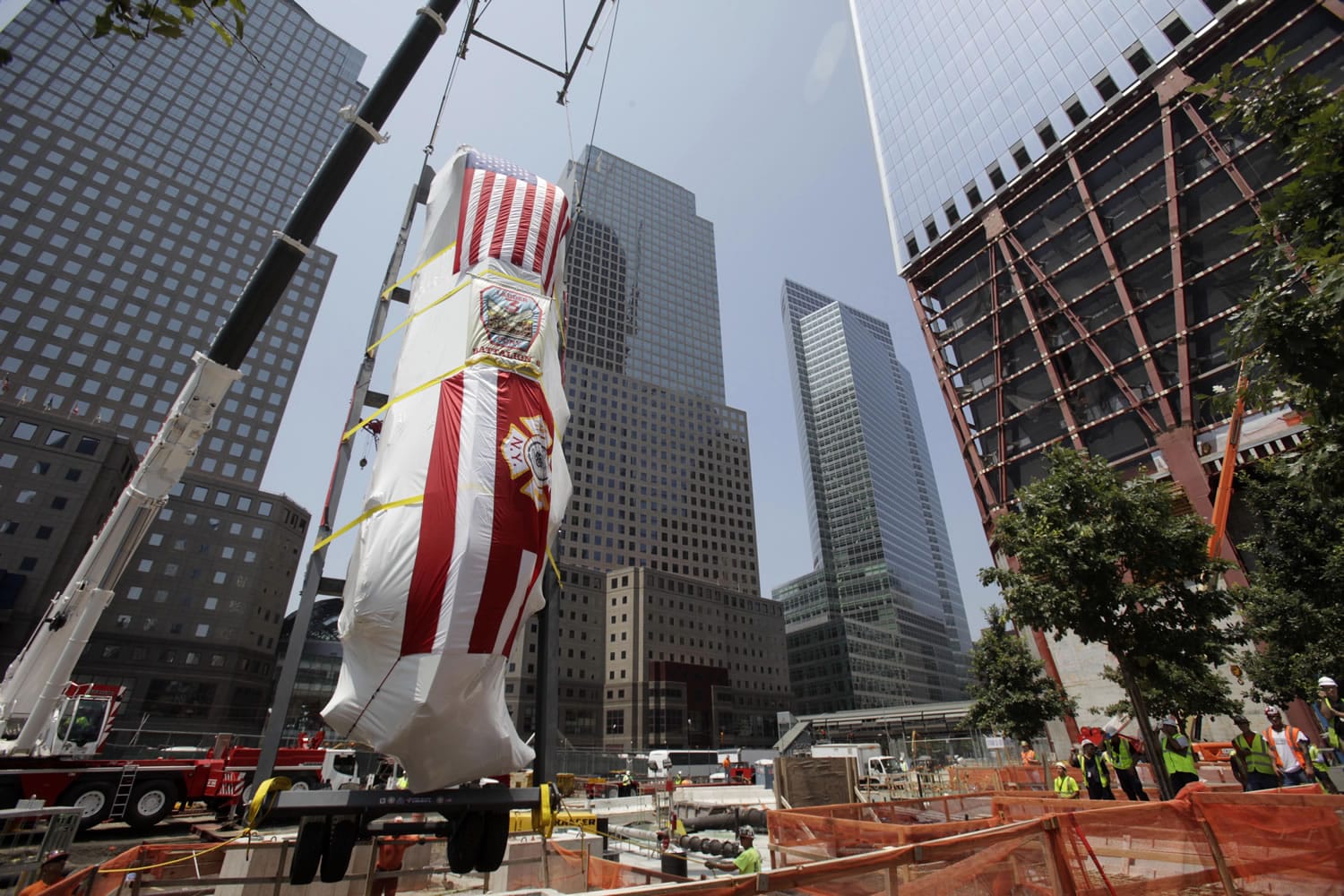 The Fire Department of New York's Ladder Company 3 fire truck is lowered by crane into the National September 11 Memorial Museum in New York on July 20. The fire truck was used to evacuate people from the World Trade Center towers during the terror attacks on Sept.