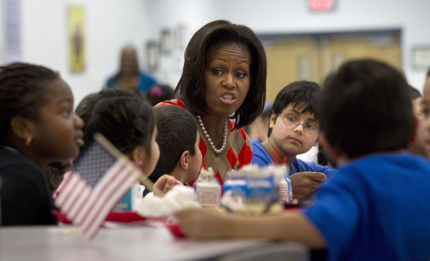 First lady Michelle Obama has lunch with school children at Parklawn elementary school in Alexandria, Va. A bipartisan Senate bill released Monday would revise healthier meal standards put into place over the last few years to give schools more flexibility in what they serve the nation&#039;s schoolchildren, easing requirements on whole grains and delaying an upcoming deadline to cut sodium levels on the lunch line.