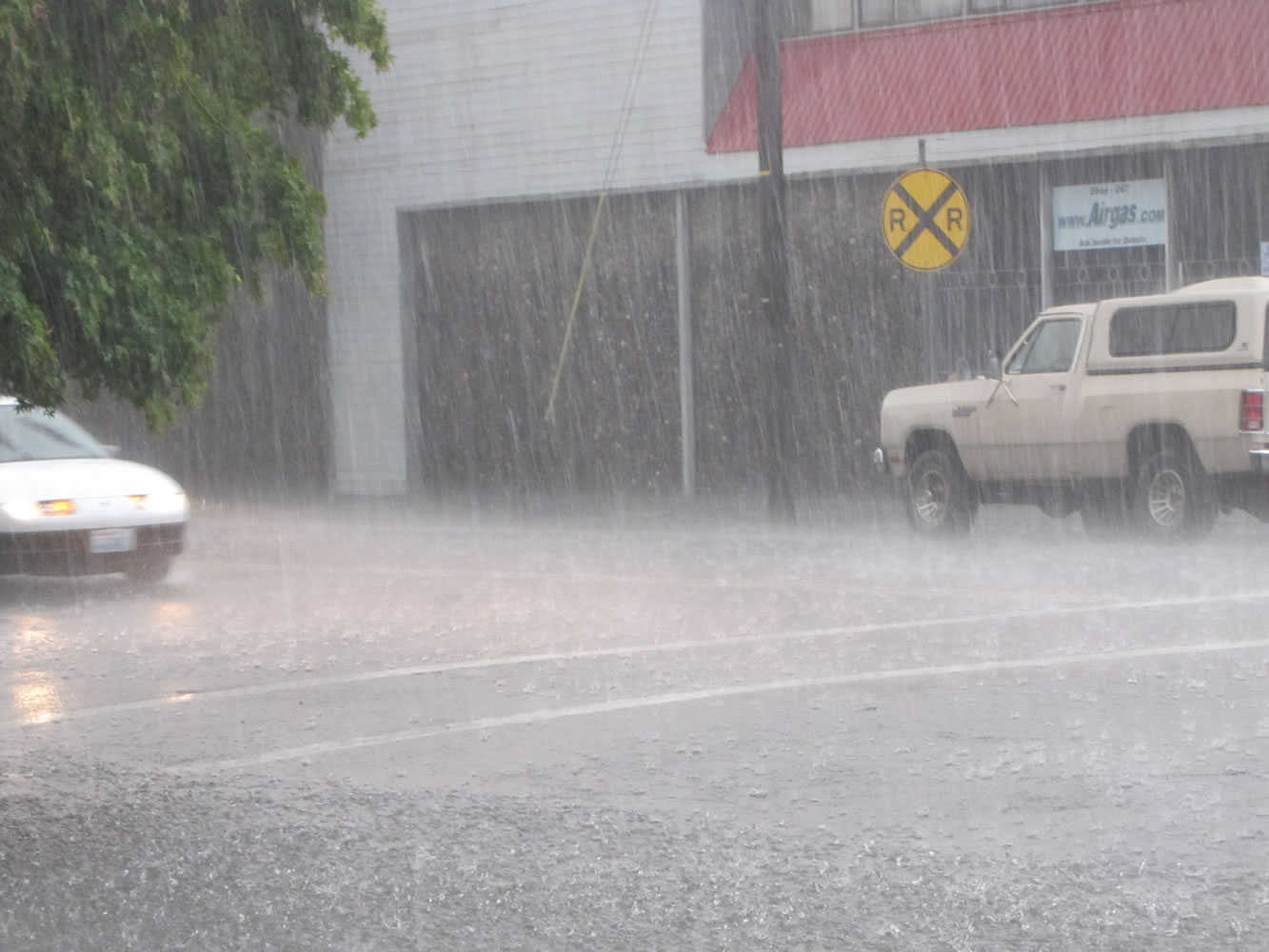 Heavy rain douses cars on West Eighth Street in downtown Vancouver during Saturday's thunderstorm.