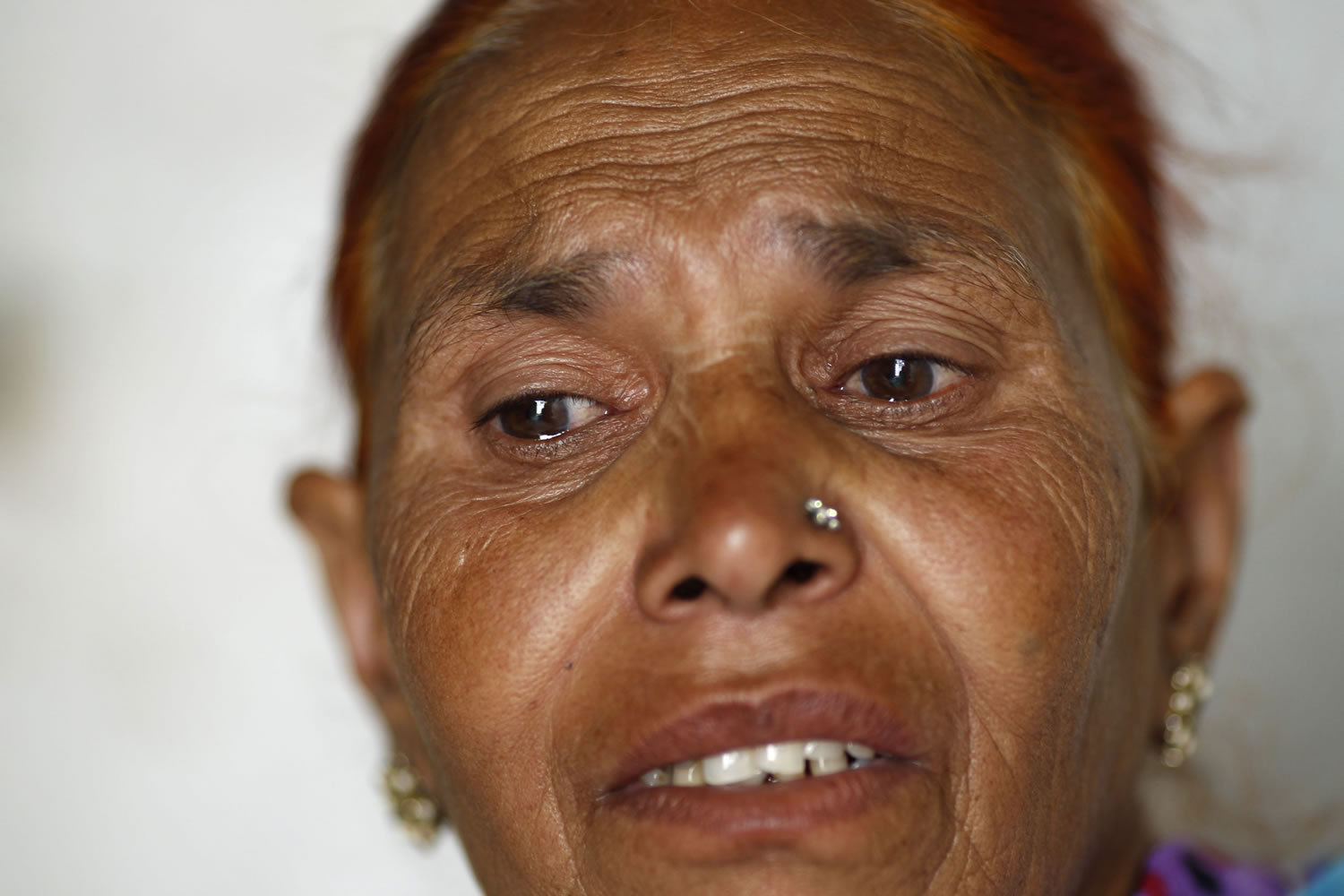 In this May 10, 2012 photo, Fatima Munshi, mother of Saroo, describes how she looked for her lost son over the years, at her home in Khandwa, India. Living in Australia, Saroo Brierley, 30, was reunited with his biological mother, Munshi, in February 2012, 25 years after an ill-fated train ride left him an orphan on the streets of Calcutta.