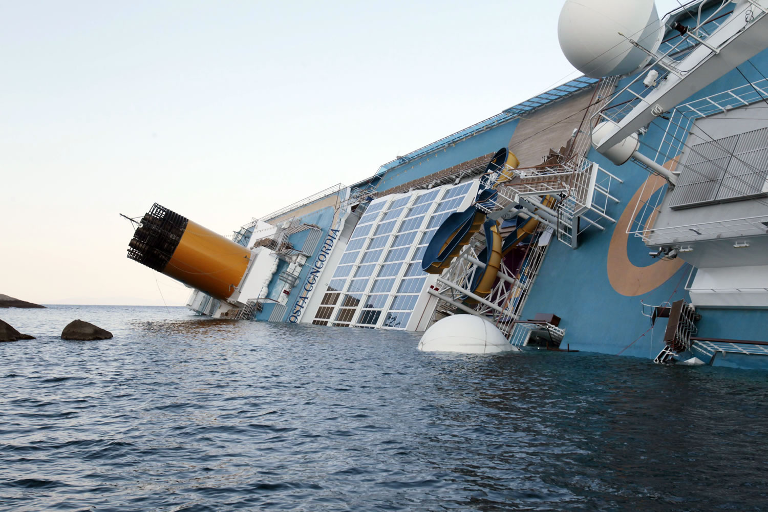 The luxury cruise ship Costa Concordia leans on its side after running aground the tiny Tuscan island of Giglio, Italy, on Saturday.