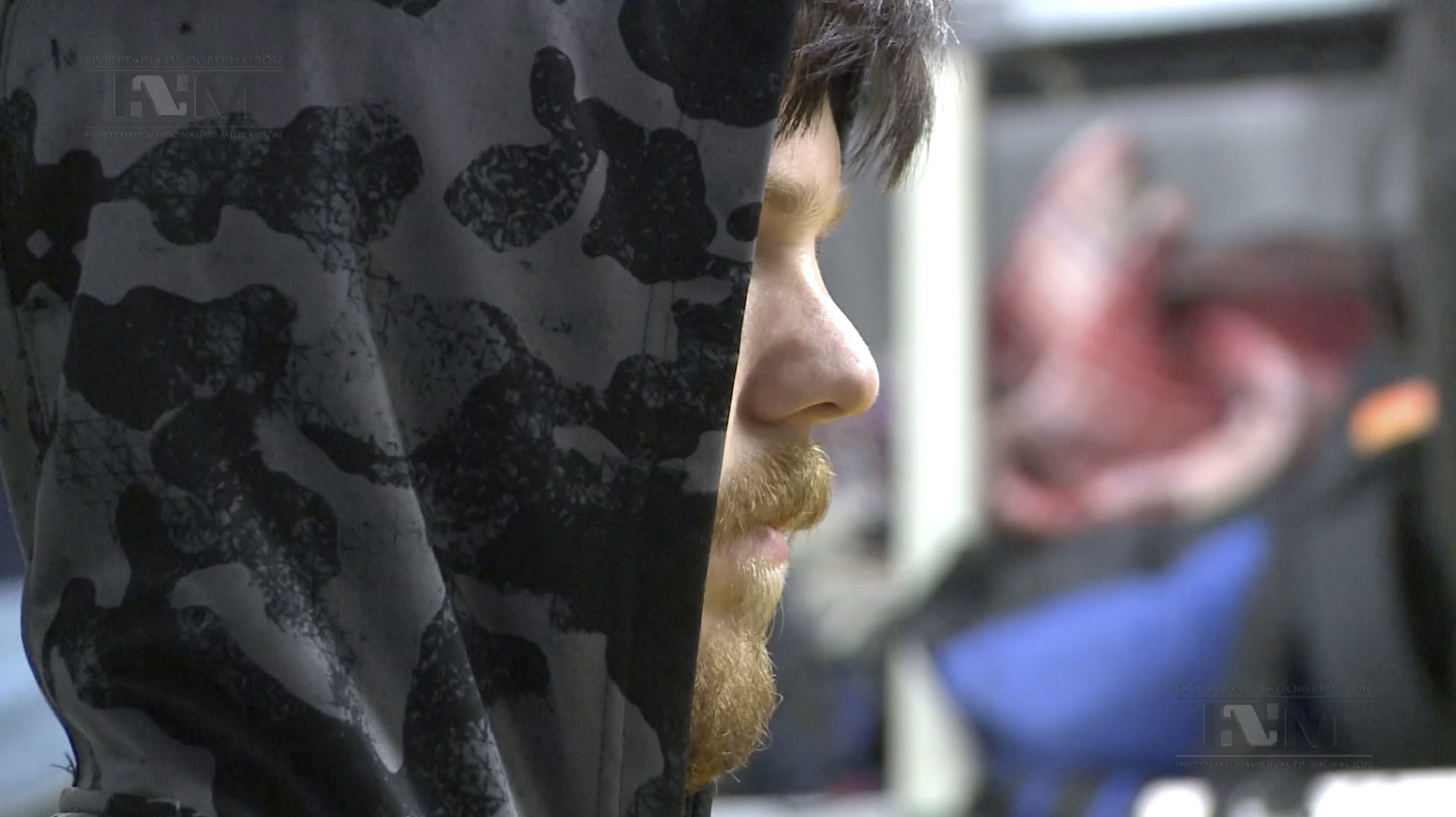 This frame grab from a Thursday video provided by Mexico&#039;s Instituto Nacional de Migracion, a hooded Ethan Couch is processed by Mexican immigration agents, in Mexico City. Couch arrived in Texas on Thursday.