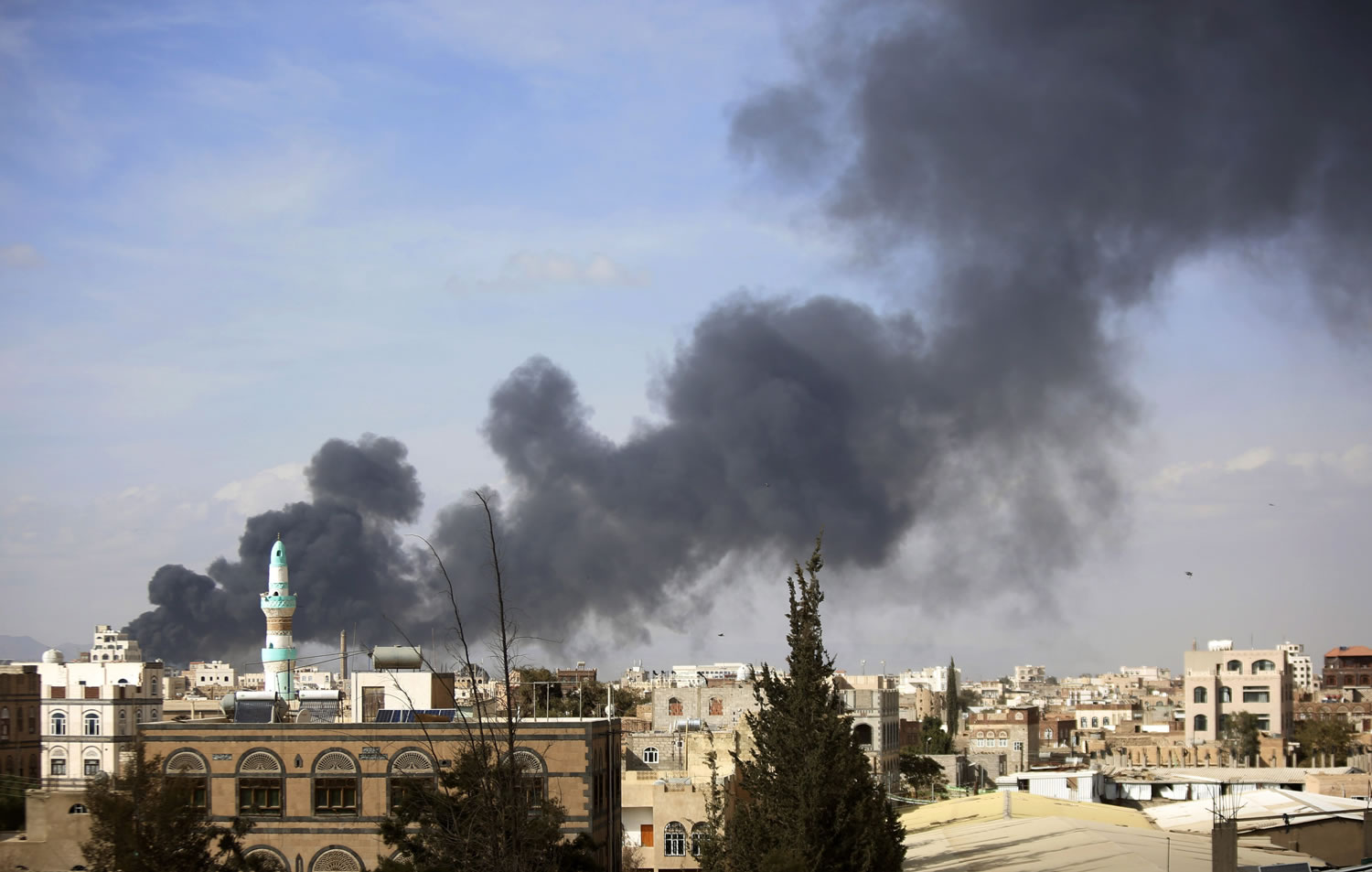 Smoke rises Saturday after Saudi-led airstrikes hit a site in Sanaa, Yemen. Airstrikes by the Saudi-led coalition targeting Yemen&#039;s Shiite rebels killed more than 32 people overnight including at least eight civilians in the capital, Sanaa, officials said Saturday.