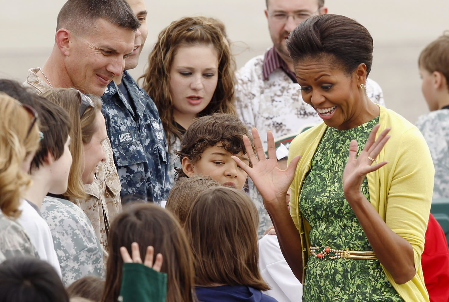 First lady Michelle Obama is greeted by Minnesota military and family members as she arrives at the Minnesota Air National Guard base March 16 in St. Paul, Minn.