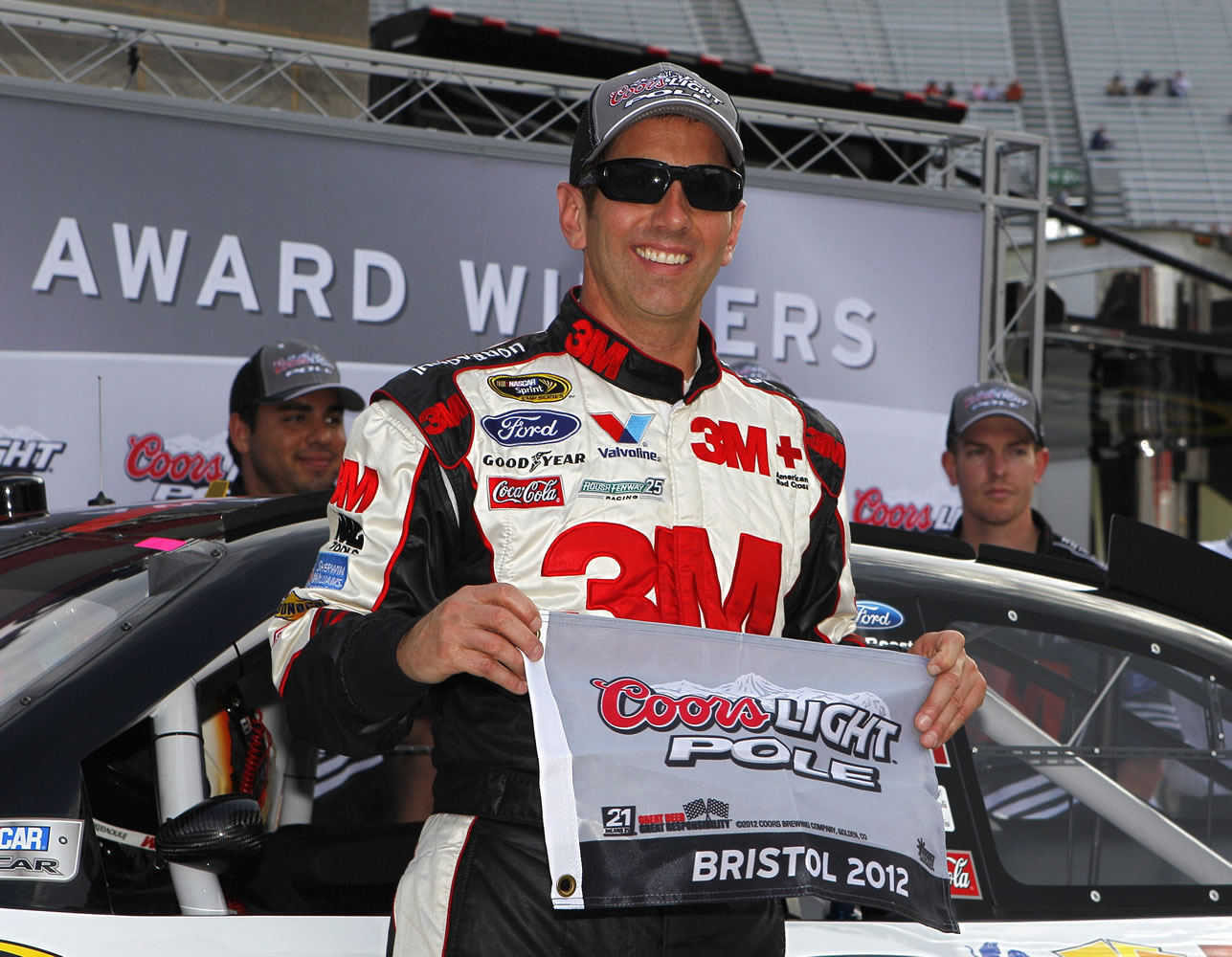 Greg Biffle poses for photos after the pole position during qualifying for Sunday's NASCAR Sprint Cup Series auto race on Friday, March 16, 2012, in Bristol, Tenn.