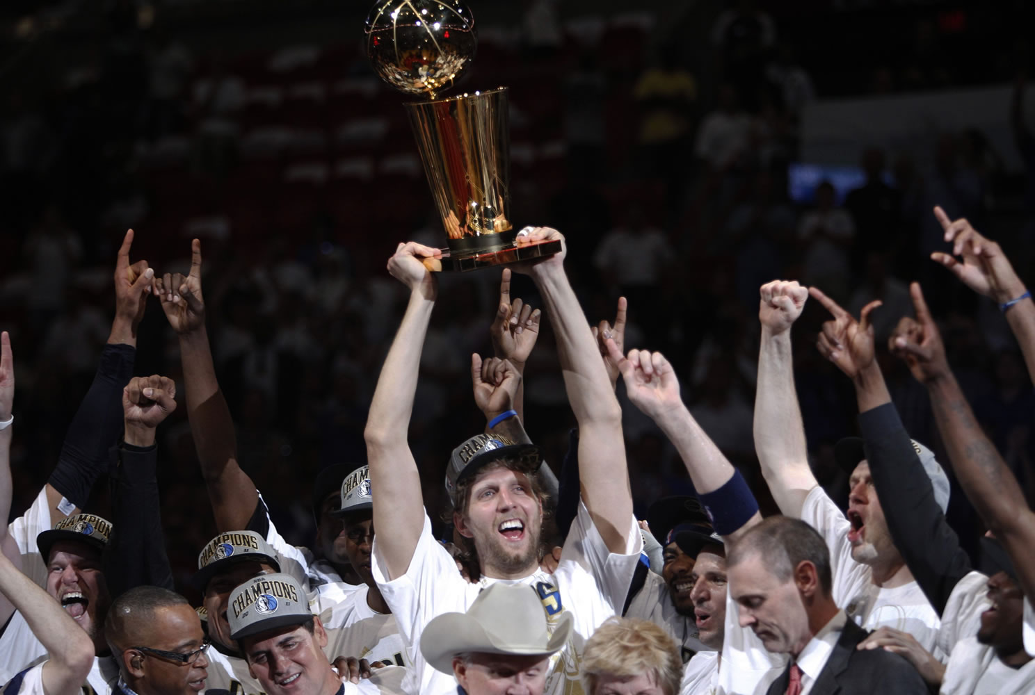 Dallas Mavericks' Dirk Nowitzki holds up the championship trophy after defeating the Miami Heat 105-95 in Game 6 of the NBA Finals on Sunday.