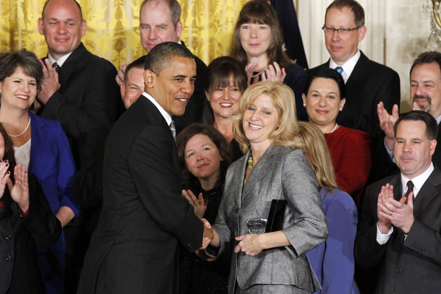 President Barack Obama congratulates Rebecca Mieliwocki, the 2012 National Teacher of the Year, Tuesday  at the White House.