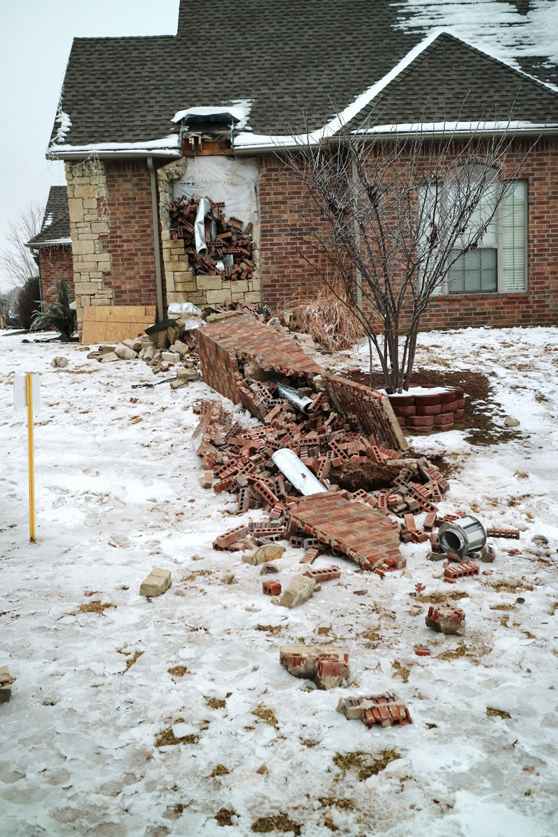 Remains of a collapsed chimney rest on the ground outside a home in Edmond, Okla., following an earthquake. In Oklahoma, now the country&#039;s earthquake capital, people are talking nervously about the big one as man-made quakes get stronger, more frequent and closer to major population centers.