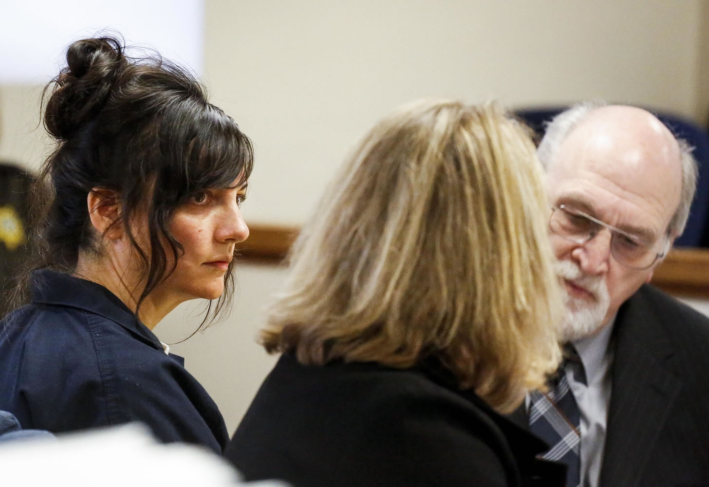 Jessica Smith, left, appears for a hearing alongside her attorneys Lynne Morgan, center, and William Falls, right, at the Clatsop County Courthouse on Jan. 14 in Astoria, Ore. Smith is charged with aggravated murder and attempted aggravated murder in the drowning death of her 2-year-old daughter and cutting the throat of her teenage daughter in Cannon Beach, Ore.