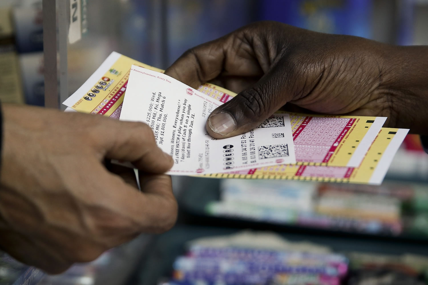 A person purchase Powerball lottery tickets from a newsstand Wednesday in Philadelphia. Players will have a chance Wednesday night at the biggest lottery prize in nearly a year.