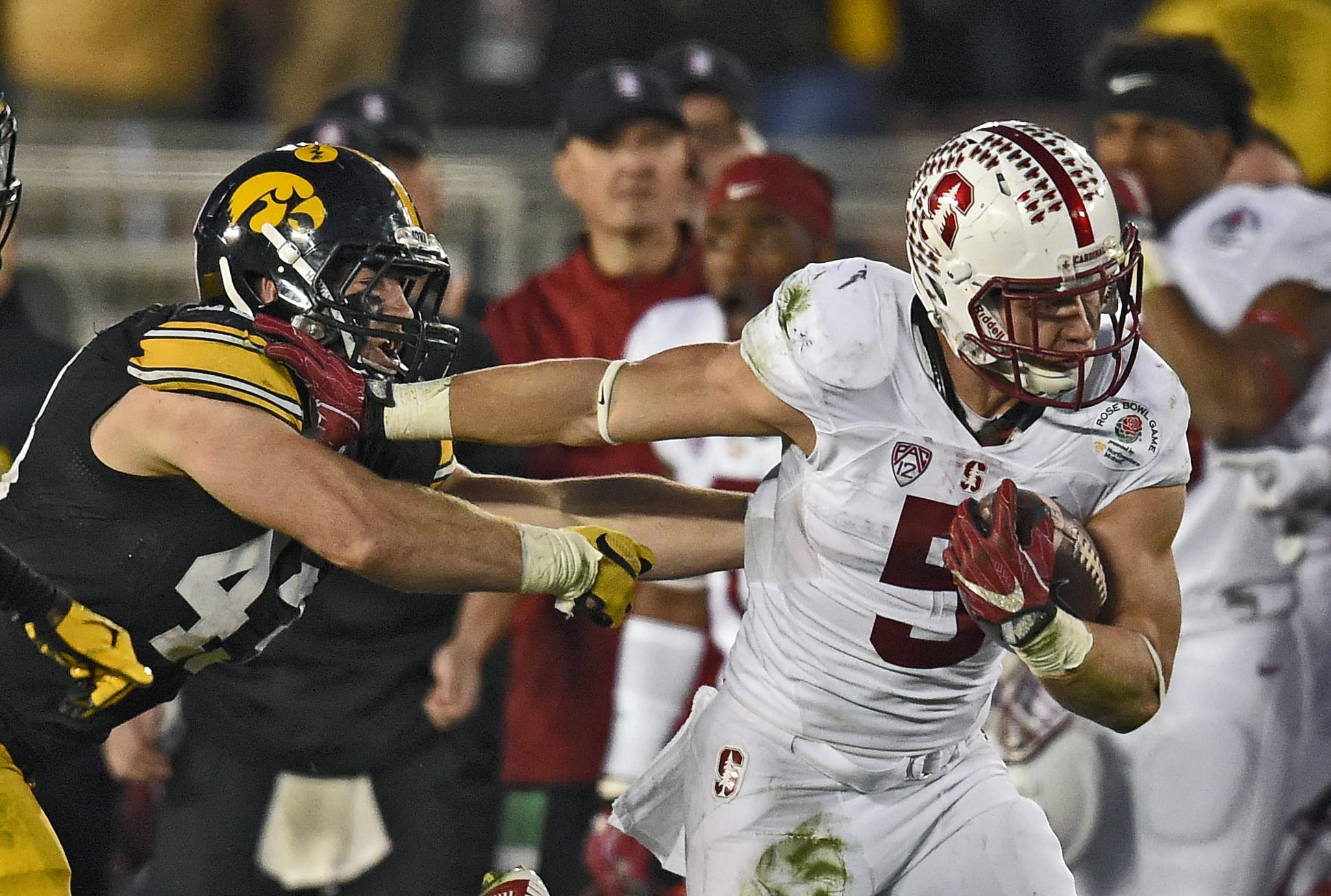 Stanford running back Christian McCaffrey, right, breaks away form Iowa linebacker Josey Jewell during the second half of the Rose Bowl NCAA college football game, Friday, Jan. 1, 2016, in Pasadena, Calif. (AP Photo/Mark J.