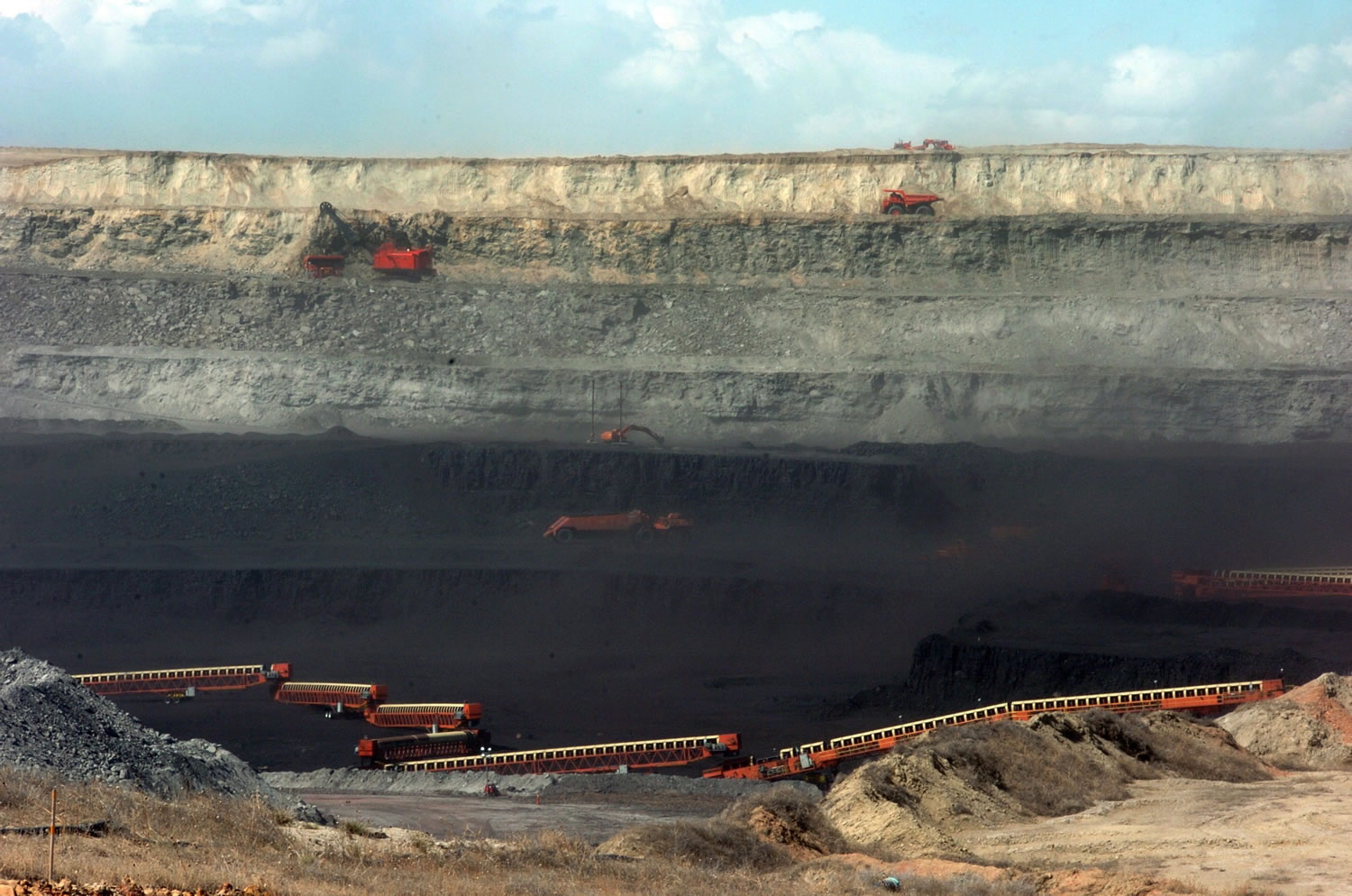 Conveyor belts and heavy equipment remove coal from the Wyodak Resources mine in northeastern Wyoming for delivery to a nearby Black Hills Power coal plant complex in Wyodak, Wyo., in 2010.