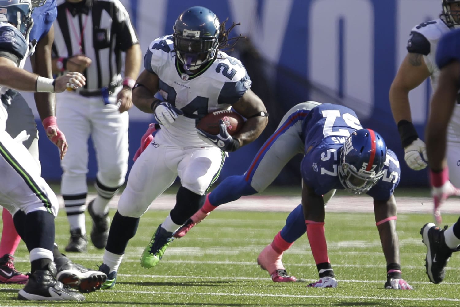 Seattle Seahawks' Marshawn Lynch (24) had 12 carries for 98 yards and a touchdown Sunday against the New York Giants.