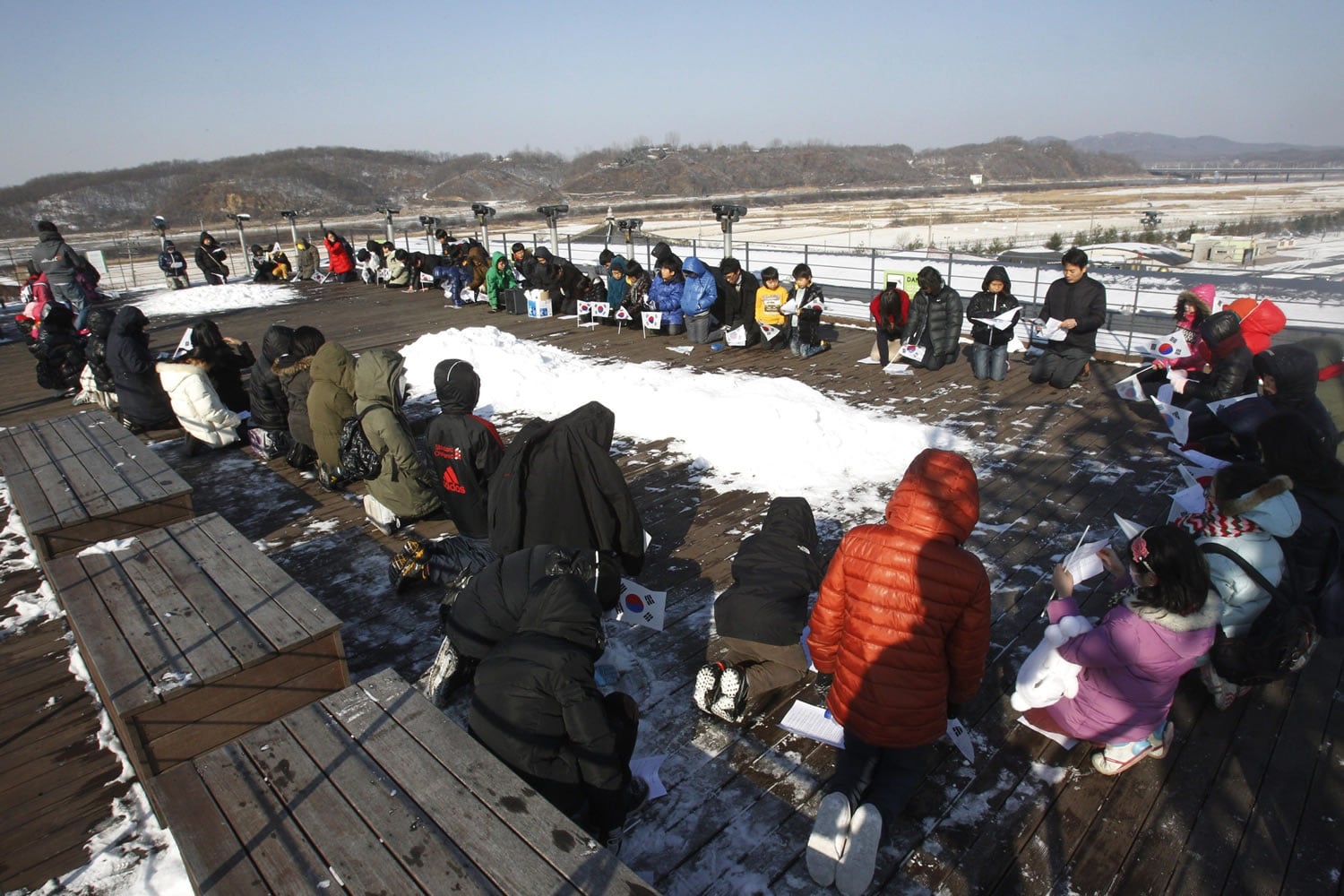 South Korean children pray Saturday for North Koreans at the Imjingak Pavilion, South Korea, near the demilitarized zone.