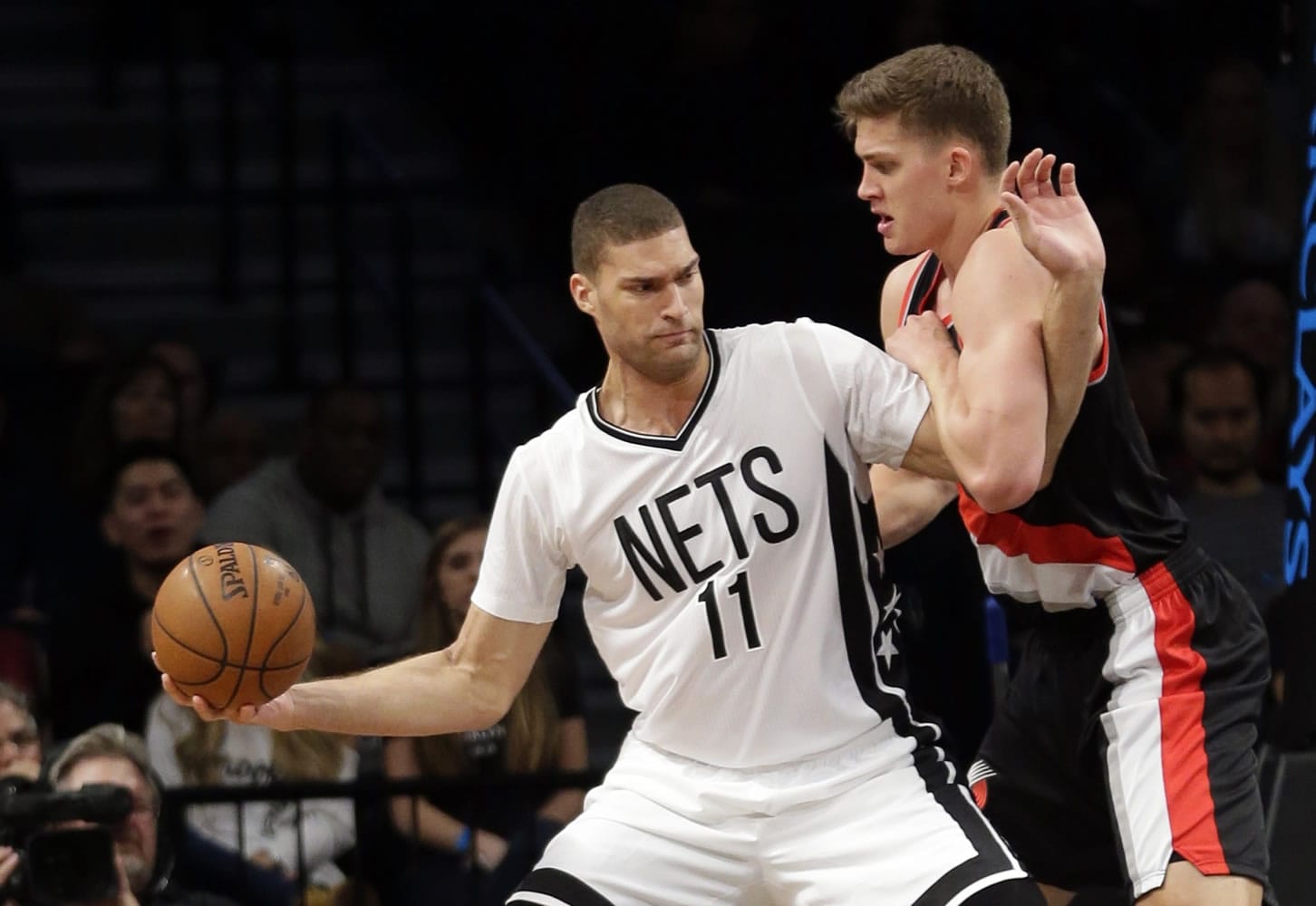 Portland Trail Blazers' Meyers Leonard, right, defends against Brooklyn Nets' Brook Lopez, left, during the first half of an NBA basketball game Friday, Jan. 15, 2016, in New York.
