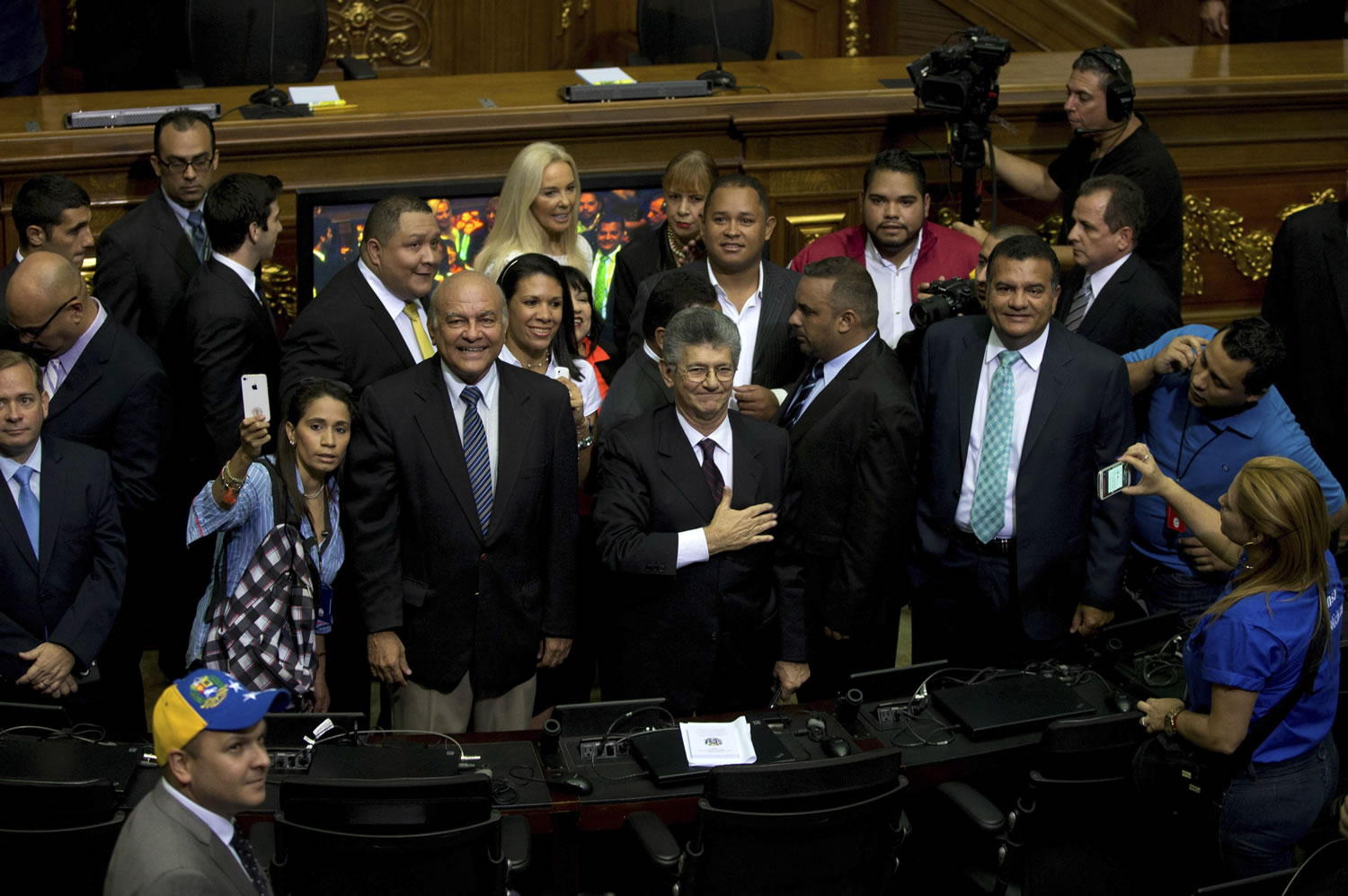 Henry Ramos Allup, incoming congress president, greets members of the news media upon his arrival to the National Assembly in Caracas, Venezuela, on Tuesday.