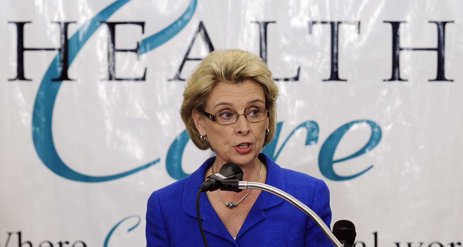 Washington Gov. Chris Gregoire talks to reporters, Thursday, May 3, 2012, at a health clinic in Tacoma, Wash., Gregoire opened up an emergency fund Thursday to help contain a whooping cough epidemic in the state as officials urged residents to get vaccinated. (AP Photo/Ted S.