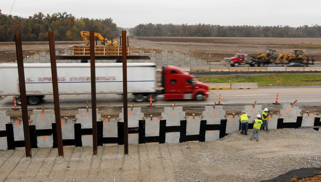 Employees for JLA Construction work on a retaining wall in 2009 that is part of an overpass being built over Highway 71 south of Lamar, Mo. The project was funded by federal dollars.