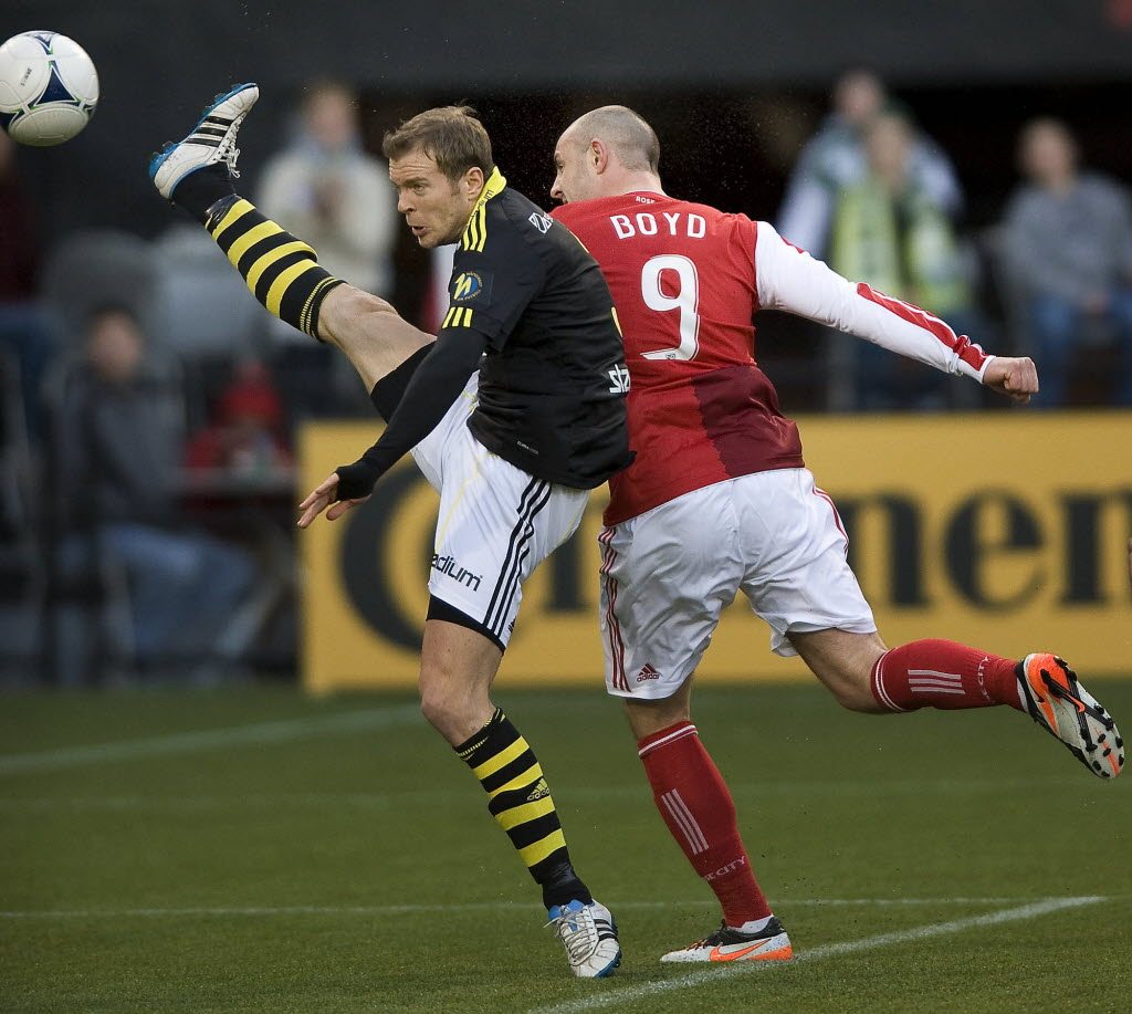 Portland's Kris Boyd (9) gets a header past Sweden's AIK defender Per Karlsson and then the goaltender for the game's only goal at Jeld-Wen Field on Sunday.