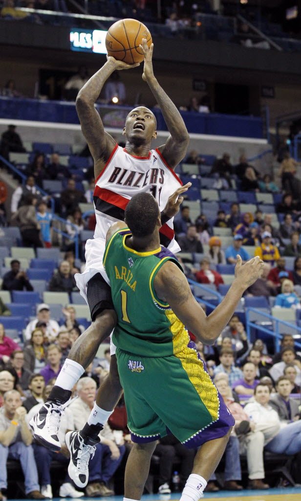 Portland Trail Blazers guard Jamal Crawford shoots over New Orleans Hornets Trevor Ariza in the second half Friday at New Orleans.